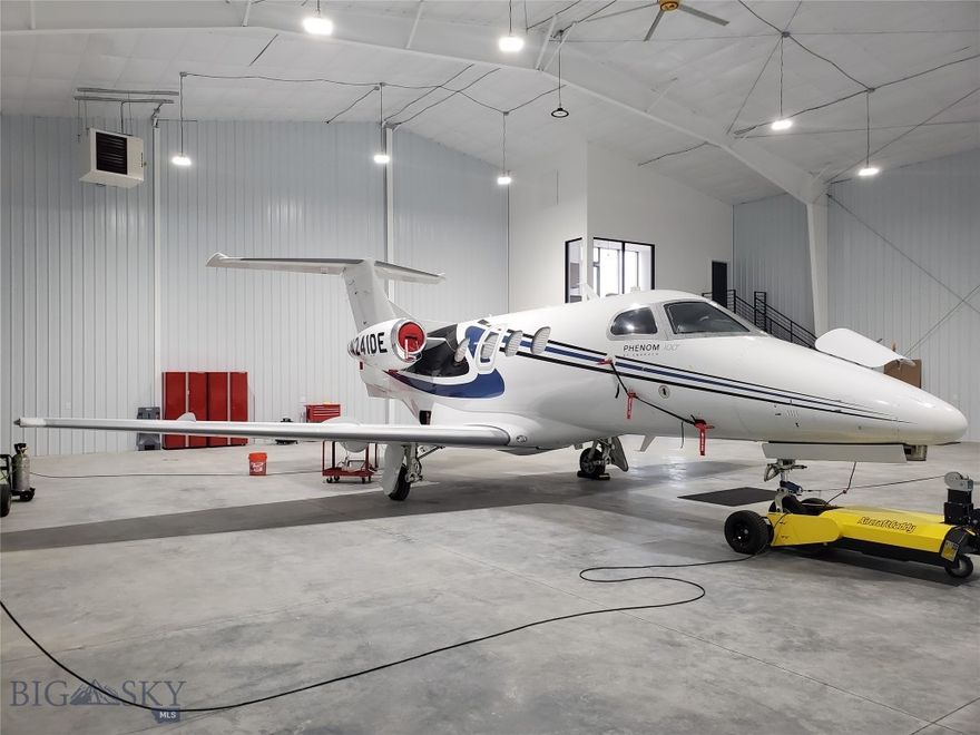 Rare opportunity to acquire a larger hangar at Bozeman Airport - BZN. Desirable location just off main taxi way F this hangar, built in 2020 has been lightly used. At 4900 SF the hangar is large enough to store two smaller light jet aircraft. The full hydraulic door dimensions are 60 feet wide by 18 foot clear height. The hangar is well equipped with a main level office with a gas fireplace and half bath, while the upper level lounge has a kitchenette and an outdoor deck that commands stunning views of the Bridger Mountains.