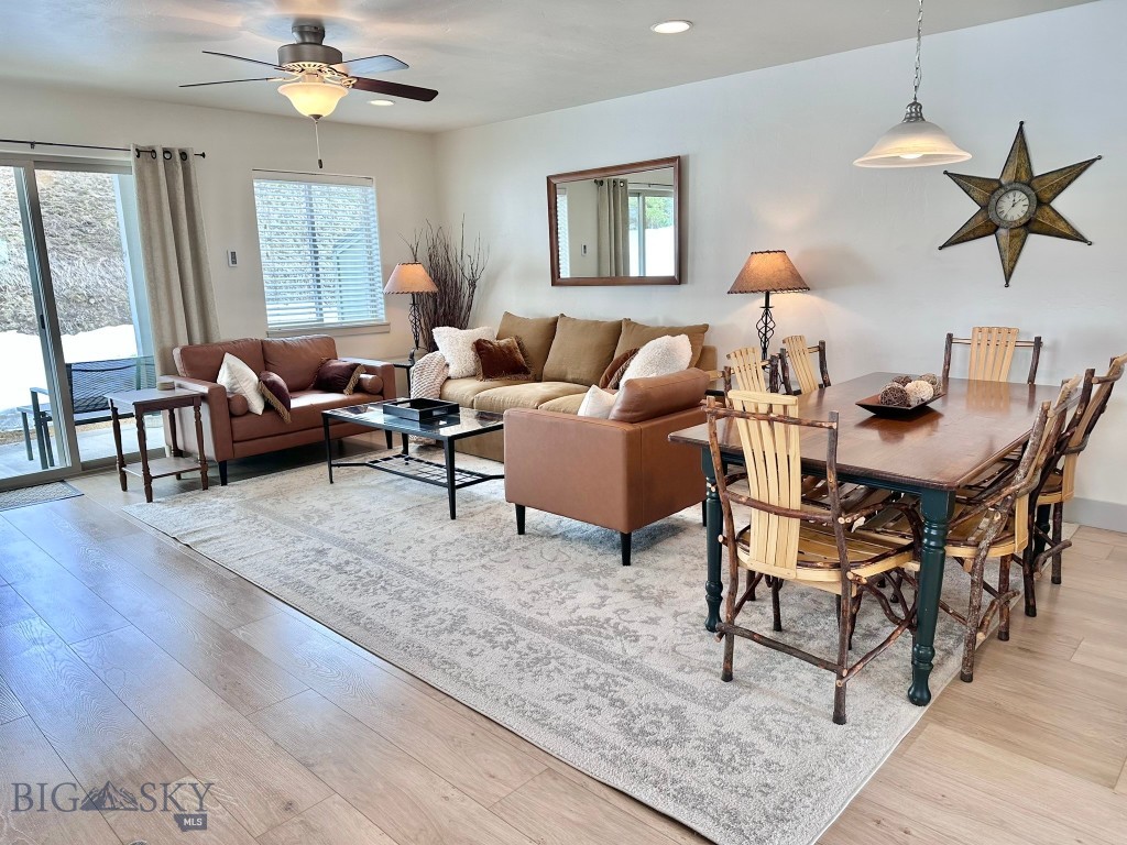 This pristine 3-bedroom condo has the best location in the Morning Sun Condos, at the end of the development for less traffic, and boasting a private entrance adjacent to BSOA open space. This unit was customized with upgraded features at the time of construction, allowing for extra windows, bathroom tile and closet pocket door. The spacious, heated garage and additional owner storage/mechanical room is on the drive-up level.  The kitchen, dining and living areas are on the first living level, as well as a half bath.  The upper level has all three bedrooms and two full bathrooms. The views to the north and west are of BSOA open space.  This bright, lovely condo is newly furnished turnkey and ready to occupy immediately with fresh paint, new mattresses, beds, carpeting and vinyl plank flooring.  The Morning Sun Condos are centrally located in the Meadow Village Subdivision, with free winter shuttle bus stop in the development, and near the golf course, area trails and groomed winter cross country ski trails, the Big Sky Community Park, activities on the Gallatin River, and all Meadow and Town Center area amenities.  The Lone Mountain Guest Ranch is five minutes away, downhill skiing at the Big Sky Resort is only 10-15 minutes away, and Yellowstone Park is just a short drive.  This condo is a true gem in a quiet, beautiful location.