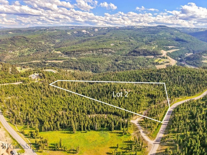 Welcome to Lot 2, Wheatgrass Meadows — 9.59 Acres of Elevated Possibility
Set on a ridge within the newest developer release in Spanish Peaks Mountain Club, Lot 2 in Wheatgrass Meadows offers an expansive 9.59-acre homesite with stunning natural surroundings and incredible potential. Framed by mature trees and neighboring open space, this parcel delivers the peace, privacy, and mountain views that define Big Sky living. The site has already been improved with initial landscaping and a roughed-in driveway, allowing you to easily walk the land and envision your future build. Take a moment at one of the scenic picnic spots placed throughout the property—perfect for soaking in the fresh mountain air and the dramatic alpine vistas that stretch in every direction. What sets Lot 2 apart is not just its size, but its flexibility. With ample room to accommodate a spacious primary residence and a separate guest home, this property invites you to think big. Whether you’re crafting a private retreat or a legacy estate to be enjoyed for generations, Lot 2 is the perfect starting point. You can bring your own architect and builder or choose to work through the Spanish Peaks Design Build Program to simplify the process from concept to completion. Ownership offers opportunity for either a Signature Golf or Social Membership at Spanish Peaks Mountain Club upon approval, giving you exclusive entry to private amenities including Tom’s 10 Par 3 Golf Course, the new Aspire Lodge, miles of trails, and year-round recreation. Just down the road, the Montage Big Sky offers five-star experiences with luxury spa services, dining, and ski access to Big Sky Resort. With only two lots available in this private enclave, Lot 2 at Wheatgrass Meadows stands as a rare opportunity to build something truly exceptional in the heart of Big Sky.