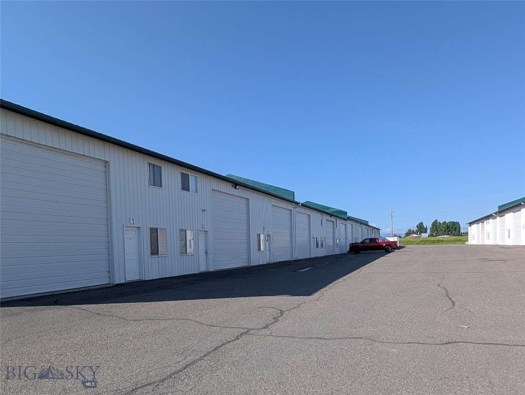 Prime Industrial & Office Space for sale in Belgrade. This versatile property offers approximately 1,800+/- square feet of combined warehouse and office space, perfect for businesses looking for a functional, secure, and convenient location. With approximately 800 sq. ft. of warehouse space and approximately 1000 sq. ft. of office space, this property is designed to meet a variety of industrial and commercial needs. This space is Ideal for storage, light manufacturing, or distribution. The warehouse is easily accessible with ample room for equipment and inventory. Office Space Includes 4 offices and one 3/4 bathroom, making it perfect for administrative functions, customer service, etc.. Light industrial zoning allows for a wide range of business operations, from manufacturing to warehousing and more. 30x40 Secure Yard Space with conex box is Fully enclosed, secure outdoor storage space for equipment, vehicles, or inventory. Easy access to major highways and Bozeman Yellowstone International Airport and the surrounding region, offering convenient transportation options. This property is ideal for businesses in need of a balanced combination of office and industrial space. Whether you're looking to expand, relocate, or start your business in a growing community, this space offers both practicality and security.