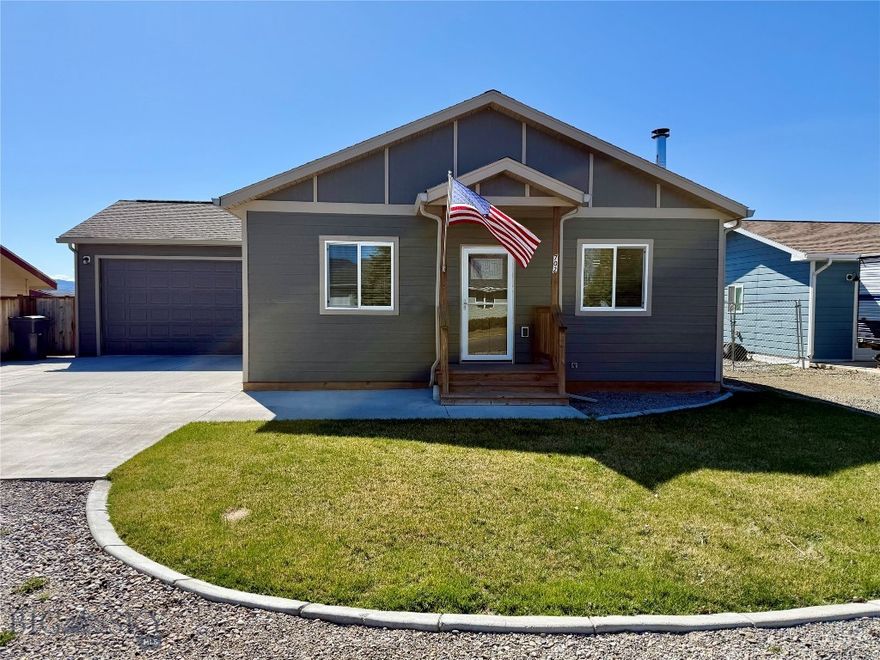 Enjoy the small-town lifestyle in Townsend, Montana. This immaculate home is move-in ready! Built in 2023 with ~1700sqft, this single-floor home provides easy living on one level. The welcoming great room has a wood stove for warmth, and the home has central A/C too. There are three bedrooms, two full baths, and a separate laundry room. The primary bedroom features a gorgeous ensuite bath with double-sinks, soaking tub, and shower. Off the bedroom, there is a lovely, covered deck to take in the views of the Horseshoe Hills. The garage is unique with double doors for convenient drive-through. Underground sprinklers keep the lawn nice and green - and there is room for a garden in the fully fenced backyard. Townsend offers K-12 schools, restaurants, dental & physician offices, grocery & hardware stores - everything you need for daily living. Townsend fun and activities include multiple parks, rodeos at the fairgrounds, and one of Montana's largest Fall Festivals in October. Townsend is conveniently located between Helena & Bozeman. Helena, only 30 miles, provides larger anchor stores and an international airport. Area attractions include Canyon Ferry Reservoir, the Missouri River, campgrounds, and public lands.