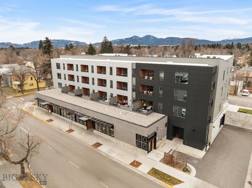 Ideally located between Downtown Bozeman, Montana State University, and the growing Midtown district, this SoBo Lofts residence offers effortless access to the best of city living. Built in 2020, this unit features a bright, open layout with contemporary finishes and large windows that bring in abundant natural light. The kitchen and living area flow seamlessly to a covered private balcony, creating an easy extension of the living space and a perfect spot to enjoy surrounding mountain and neighborhood views. The bedroom is comfortable and well-appointed, with a three-quarter bath and in-unit laundry for everyday convenience. Additional amenities include elevator access, reserved alley parking, and low-maintenance living. Offered fully furnished and turn-key, this is a prime opportunity in one of Bozeman's most coveted areas. With close proximity to restaurants, shops, campus, and entertainment, while still being just minutes from Bozeman’s trail systems and outdoor recreation, this smart, stylish residence is based in one of the city’s most connected locations.