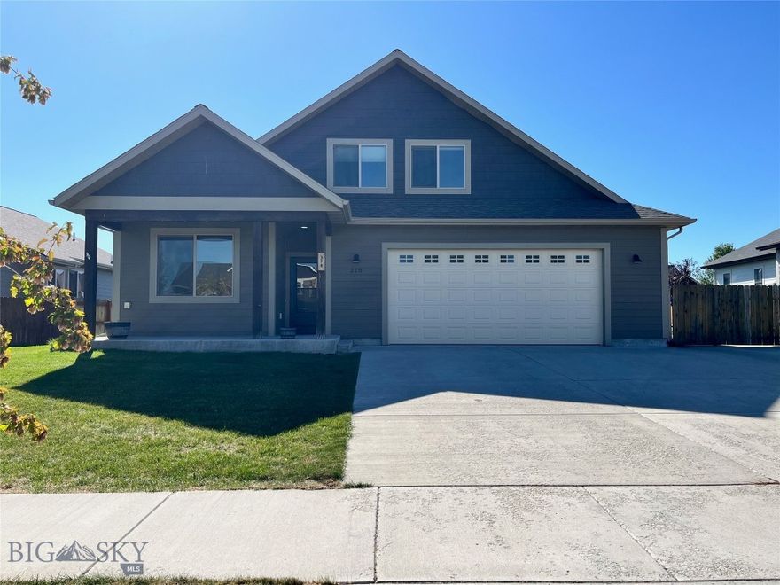 Discover this thoughtfully designed home boasting over 2,500 sq. ft. of living space, with 4 bedrooms, including a main floor master suite and a separate upstairs guest suite with a BONUS family room. The open-concept layout features vaulted ceilings, large windows, and a cozy gas fireplace, creating a warm and inviting space. The kitchen is a chef's delight, offering a gas range, pantry, and eat-in bar, complemented by beautiful granite countertops and stainless steel appliances. The master suite impresses with dual vanities, a walk-in closet, and elegant finishes throughout. You'll find a mix of rich alder wood trim, laminate flooring in the main living areas, and tiled bathrooms and laundry. The home comes fully equipped with air conditioning, a rock fireplace, and modern smart home features, including light switches and outlets. Outside, enjoy the spacious fenced yard with mature landscaping, a large patio, and a relaxing hot tub. The property also includes a concrete parking pad (approx. 14' x 50') with a 220v plug and an oversized garage. Located just minutes west of Bozeman, this home is the perfect blend of comfort and convenience.