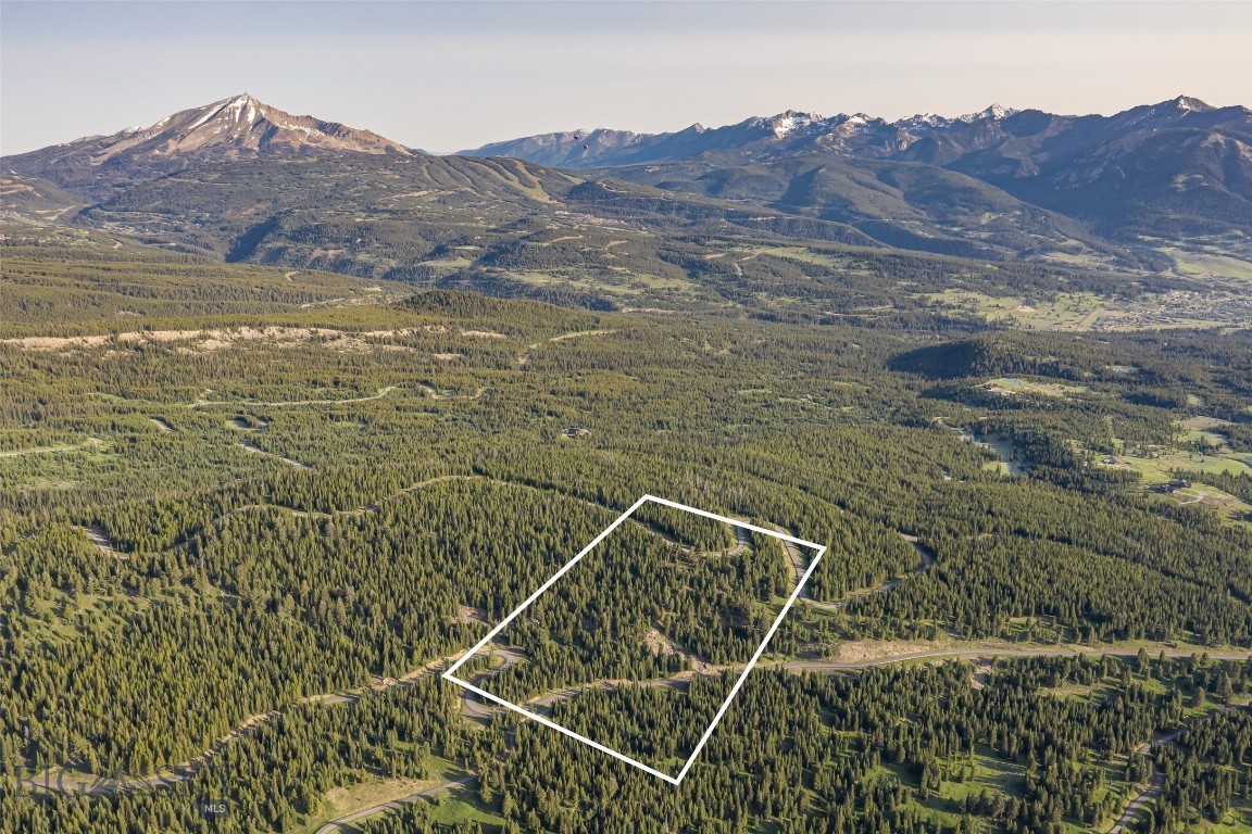 Discover the Pinnacle of Refined Mountain Living at Big EZ Estates – Lot 30
Nestled within the exclusive Big EZ Estates, Lot 30 offers an extraordinary 20-acre sanctuary, providing the ultimate blend of privacy, luxury, and natural beauty. This rare parcel is conveniently located just minutes from the heart of Big Sky Town Center, with paved road access and secure, gated entry, ensuring both privacy and convenience to neighboring private clubs Yellowstone Club and Spanish Peaks Mountain Club and minutes to the restaurants and shopping, farmers markets, concert series and rodeo in the Big Sky Town Center and 25 minutes to world class amenities of Big Sky Ski & Summer Resort.
Embrace awe-inspiring panoramic views of Lone Peak, Pioneer Mountain, and the iconic Spanish Peaks, where the landscape stretches in every direction to offer a visual masterpiece at every turn. Whether you’re imagining a serene private residence or an exceptional mountain retreat, this stunning lot serves as the perfect canvas for your Montana dream home.
At Big EZ Estates, exclusivity and tranquility come together in a community that celebrates both expansive natural landscapes and refined mountain living. With access to coveted amenities and a location that balances privacy with convenience, this property offers an unparalleled opportunity to craft your own legacy in one of the most sought-after areas of Big Sky.
Don’t miss the rare chance to own a piece of Big Sky’s most coveted and private enclave. Schedule your exclusive tour today and step into the epitome of mountain luxury living.