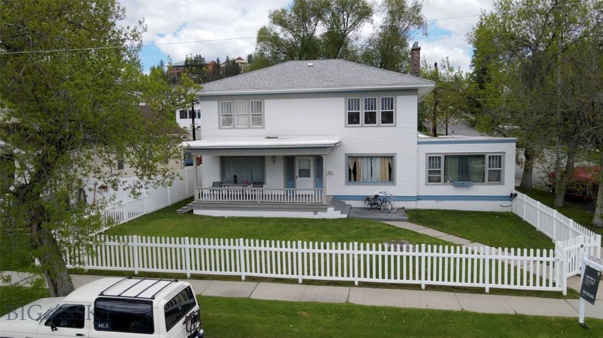 Welcome to this Butte treasure – a grand 1923 home in the coveted West Side.  This distinguished 6 bedroom, 3.5 bath home spans over 3.700 square feet of finished living area across the main floor and second floor, plus a full - unfinished basement.  From it’s architectural character to it’s thoughtful modern touches, this home blends the best of both worlds.  Here’s what makes this property special and what you will love:
• A grand foyer that sets a warm and impressive tone.
• An impressive hand-carved staircase
• Elegant formal dining room.
• Homey living room warmed by a gas fireplace.
• Cozy built-in breakfast nook for casual meals.
• Spacious Master Suite with ensuite bath for your private retreat, with a sitting area and large walk-in closet
• Original and rich hardwoods. 
• Potential for a private in-law suite with separate access
• South facing with large windows that fills the house with natural sunlight.
• A full basement with laundry and tons of storage
• Oversized 3-car attached garage—rare for homes of this era.
• Covered back patio featuring a built-in kitchen and privacy fencing.
• Potential for a roof-top deck.
Whether you're drawn to vintage warmth or need room to grow, this house delivers in style, space, and location.