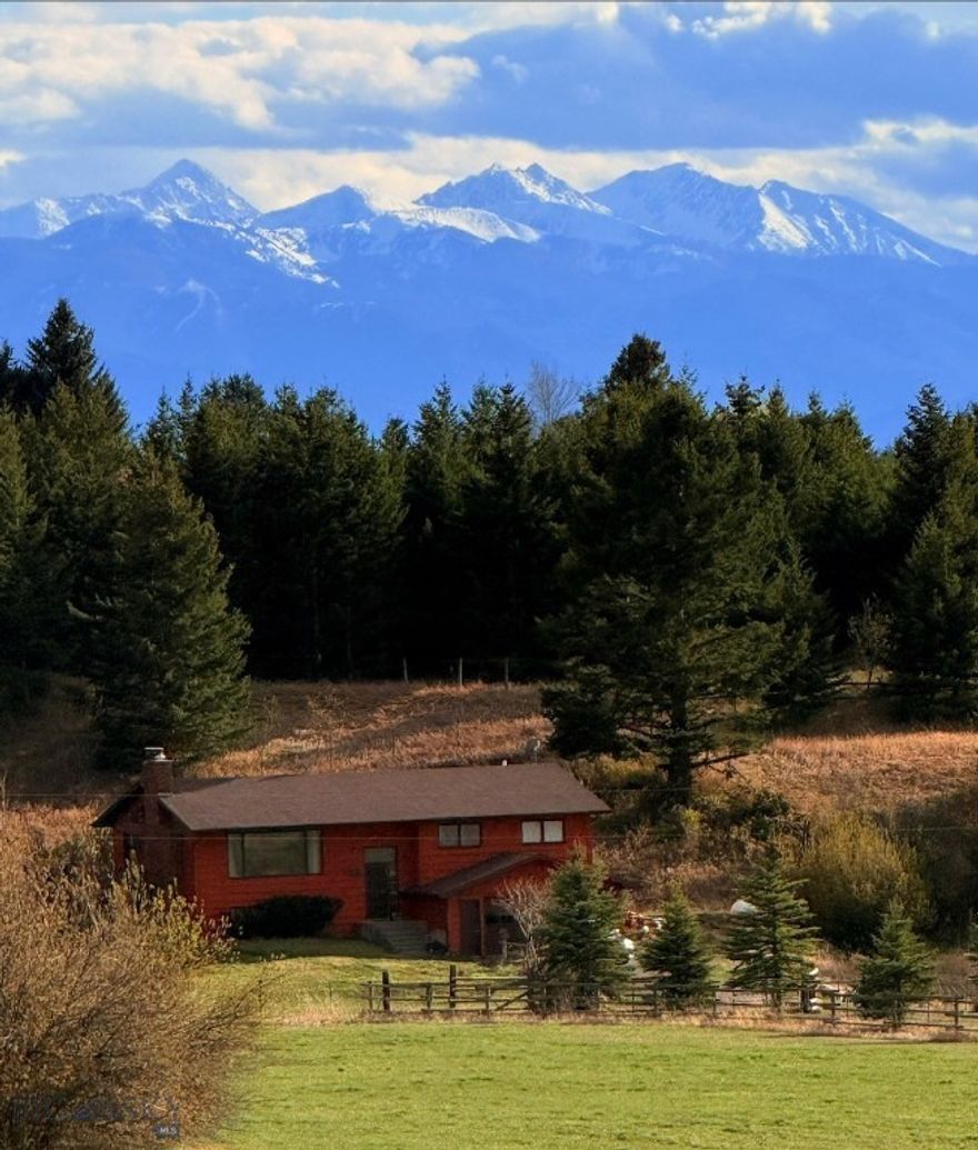 Highly sought after location of this ten-acre horse property puts you only a 5 minute walk from the Sypes Canyon Trailhead and 15 minutes from the Main Street of downtown Bozeman, Montana.  The Bozeman Yellowstone International Airport is a quick 15 minutes away and you can stock up on food at Costco only 10 minutes away. In addition to the current home there are several potential build sites just waiting for that second dwelling to be built.
A horse barn "built for two" combines ample hay storage, space for tack, and run in quarters for a couple horses, cows or ?? Two domestic wells already drilled on the property afford plenty of water for man and beast. For the discerning buyer this property offers an incredible location and a wonderful opportunity to build a new home in one of the most attractive areas of the Gallatin valley. Live in the current home while having that "Forever Home" built or remodel /add on and update it to make it your own.