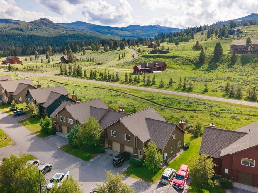 Just one mile from the heart of Big Sky, this end-unit chalet at 417 Firelight Drive offers the perfect balance of convenience, privacy, and outdoor adventure. With its prime location bordering open space and the added privacy and natural light of an end-unit, this home lives like a single-family residence.  Inside, you’ll find three ensuite bedrooms, a versatile loft, and a one-car garage — ideal for full-time living or a mountain getaway. This thoughtfully designed 3-bedroom, 3-bathroom condo provides generous space for both family life and hosting guests.  The open-concept layout features a cozy fireplace, soaring ceilings, and expansive windows that flood the interior with natural light while framing the breathtaking Montana landscape — perfect for gathering with friends or simply unwinding in comfort.