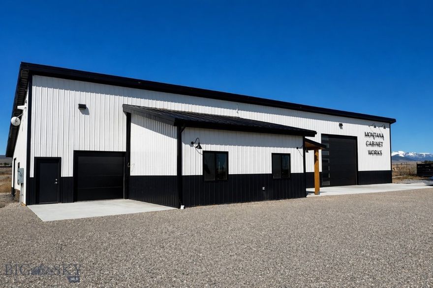 Built in 2023, this modern black and white commercial shop offers a strong, professional presence approximately 3 miles north of Dillon off Highway 91. Set on 2+/- acres, the property provides open space for working operations, equipment and storage. The large parking area can accommodate customer parking, big equipment and multiple vehicles.

The 4,460 sqft shop is designed for functionality, featuring a dedicated office area and a loft space with a negotiable rotary screw compressor. The 16'x14' garage door allows for easy access for larger vehicles and equipment, while a separate 8'x8' loading garage door provides additional convenience for workflow and deliveries. The building is equipped with 3-phase power through Vigilante Electric, supporting a wide range of commercial or light industrial uses. The attached ~460 sqft showroom provides the perfect place to meet with clients. It includes its own entrance, creating a defined space for customer interaction or display, along with custom cabinetry, stone countertops and a convenient half bathroom.

Efficiency and comfort are built in with in-floor heat powered by an electric boiler and spray foam insulation throughout. A stainless steel utility sink washing area allows for easy cleanup, adding everyday practicality to the workspace. 

Finished with durable metal siding and a metal roof, this property offers low-maintenance ownership with a clean, modern aesthetic and practical design for daily use. With a private septic and well and no covenants, this property is ready for you to make it your own! Equipment is negotiable on a separate bill of sale.