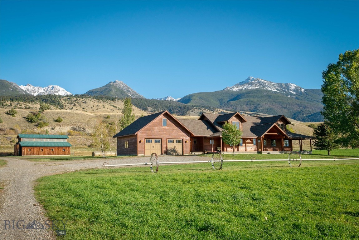 BRING YOUR HORSES to the perfect Lifestyle Ranch in the heart of Paradise Valley. 44.16 lush acres with first water rights from Strawberry Creek that irrigate a productive 35-acre hay field yielding up to 5 tons per acre - All wheel lines and irrigation equipment conveys with the property. The CUSTOM DESIGNED 3-bedroom, 2.5-bath residence offers a rare blend of comfort, craftsmanship, and breathtaking scenery. In winter, gather around the wood-burning fireplace and take in the sweeping views of the Absaroka Mountains, perfectly framed by the living room’s expansive wall of windows. The thoughtfully designed main level features a spacious primary suite, formal dining room, inviting living area, well-appointed kitchen, and laundry room. Upstairs, you'll find two additional bedrooms, a full bath, and a loft, bringing the finished living space to approximately 3,500 square feet. A 1,772-square-foot unfinished basement and a bonus room above the garage offer ample potential for future expansion. Outside, the property is equally impressive. A 28' x 40' workshop with a 12' x 26' lean-to and a 35' x 45' post-and-beam barn provide versatile space for livestock, hay and equipment storage, or hobbies. Wildlife lovers will appreciate the seasonal visits from elk herds with as many as 300 elk. And when summer arrives, the wrap-around covered porch becomes the perfect retreat—offering shade, serenity, and a front-row seat to Montana’s natural beauty. LOCATION is less than 30 minutes to Livingston, 40 minutes to Yellowstone National Park, and 10 minutes to Chico Hot Springs Resort, Sage Lodge, Yellowstone River fishing access, and all the amenities of Emigrant, MT. TONS OF WATER, SPECTACULAR VIEWS, FANTACTIC LOCATION - call for your appointment today!