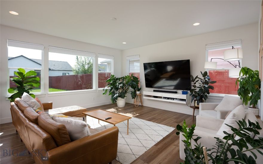 This is a turn-key home that blends modern upgrades, thoughtful design, and Bridger mountain views. The furnishings can be included or not. Lots of upgrades: a larger lot, epoxied garage and front porch, furnace humidifier, a different and unique back porch that includes a pergola, new faucets, glass shower door, upgraded internet, and electronic remote window shades downstairs and upstairs that you can open and close all of them with the push of a button. Built in 2020 and meticulously maintained, this home sits on a spacious, fully fenced lot backing to evening alpenglow over the Bridger Mountains. The classic front porch with seating invites you to relax and enjoy the quiet neighborhood, just around the corner from the community park. Inside, the living area is bright and open, with abundant natural light pouring through large picture windows. Stylish finishes include luxury vinyl plank flooring, a sleek wall-mounted media console, and designer furnishings--all of which can convey with the home, including Samsung Frame TVs that double as elegant artwork that adjusts to the ambiance. The home features 3 bedrooms, an office with a barn door being used as a main floor guest bedroom, and an upstairs bonus room currently used as a bunkroom--perfect for flexible living or additional guests. The back patio, complete with a custom pergola that includes a removable cover, is ideal for dining alfresco while taking in the Bridger views. Currently used as a lightly rented short-term stay, this property offers the rare opportunity to own a beautifully furnished and move-in-ready home in one of Belgrade's most accessible neighborhoods. Whether you're looking for a primary residence, a second home, or an investment property, this home delivers style, function, and comfort in every detail.