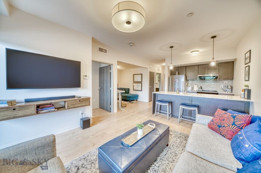 Located just a block from Main Street in one of Bozeman’s most walkable neighborhoods, this 1-bedroom, 1-bath, fully furnished condo puts you right in the middle of it all. Midtown, MSU, and a wide range of local coffee shops, restaurants, breweries, music venues, and galleries are all within easy reach. The unit is bright and comfortable, with clean modern finishes, an open layout, and a private balcony facing the southern mountains. Natural light fills the space, creating a warm and welcoming atmosphere. It’s designed for low maintenance living, with secure building access, dedicated off-street parking, and a layout that works well as a full-time home, weekend getaway, or convenient lock and leave. In addition to everything Bozeman offers in town, you’re just minutes from endless outdoor recreation. Hiking trails, ski areas, and world-class fly fishing are all nearby, making it easy to enjoy the best of Montana’s landscapes and lifestyle. This condo brings together urban energy, outdoor access, and everyday ease in one central location—offering a low-maintenance retreat with true lock-and-leave convenience right in the heart of Bozeman.