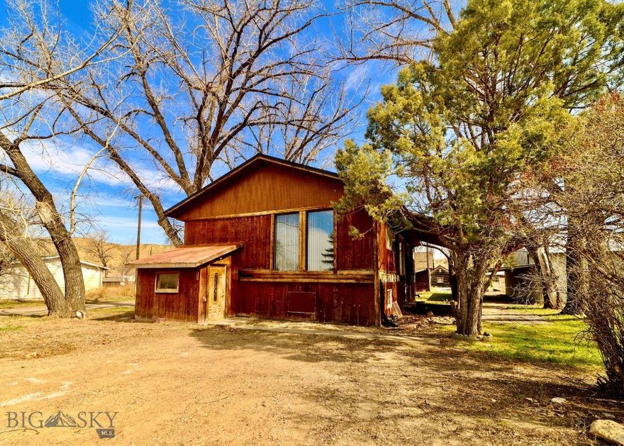 Two of Montana's most legendary rivers meet at your back door. Welcome to Loma where the Marias and Missouri Rivers converge! This 4-bed, 2-bath, 2,688 sq. ft. home is packed with personality and priced to move! Wood-paneled walls, a stone fireplace, two wood-burning stoves, and a pellet stove set the rustic tone. Two living areas, a jetted tub, and a fully loaded kitchen with modern appliances mean you're not sacrificing comfort for the country life. A detached garage, two lean-tos, and a massive open shop are ready for every truck, trailer, and trophy mount you can throw at them. Step out the door and into some of the best hunting and fishing in the state. Northern Pike, Walleye, and Catfish in the rivers. Whitetail, mule deer, upland birds, and waterfowl in every direction. The Highwood Mountains, Bears Paw Mountains, and the iconic Missouri River Breaks are all within easy reach for float trips, hiking, and camping. Fort Benton, MT is a short drive with a hospital, grocery store, restaurants, and museums! The possibilities flow like the Mighty Mo with this property!
