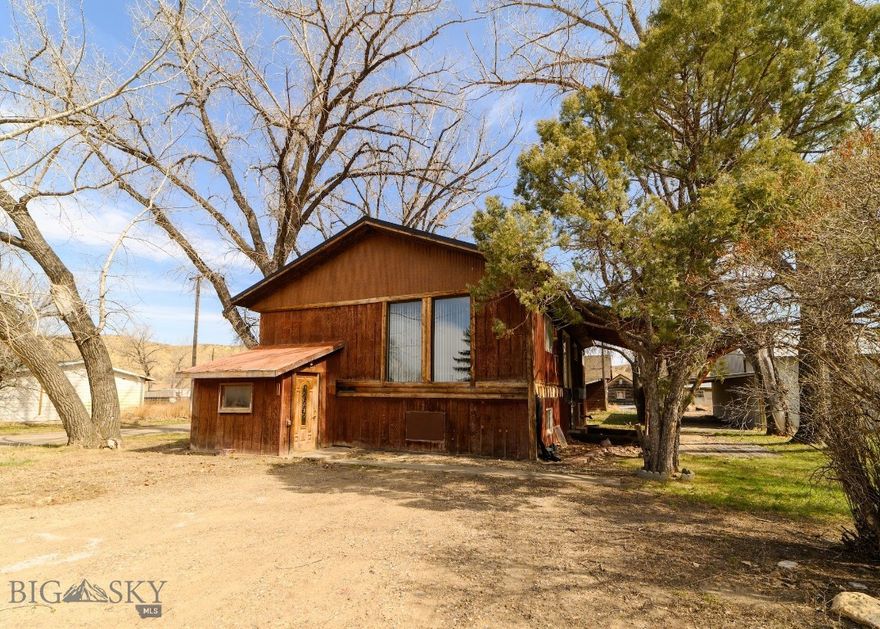 This four-bedroom, two-bathroom property offers exceptional investment potential with stunning Missouri River views and expansive Big Sky scenery. The covered front porch provides comfortable outdoor relaxation beneath mature shade trees that enhance the natural setting. Practical amenities include dedicated RV and boat parking areas, perfect for recreational vehicle storage and river access activities. The open concept living area and convenient main floor laundry room add functional appeal to the floor plan.

The location provides excellent access to outdoor recreation, with proximity to Loma Bridge fishing access and easy Missouri River entry points. Daily conveniences are nearby including Loma Post Office and Loma Country Store just minutes away. With thoughtful updates and renovations, this property could be transformed into a remarkable riverside retreat while building substantial equity in this sought-after location.

Contact us today to schedule a viewing and explore the potential this property offers with its solid layout and convenient location.
