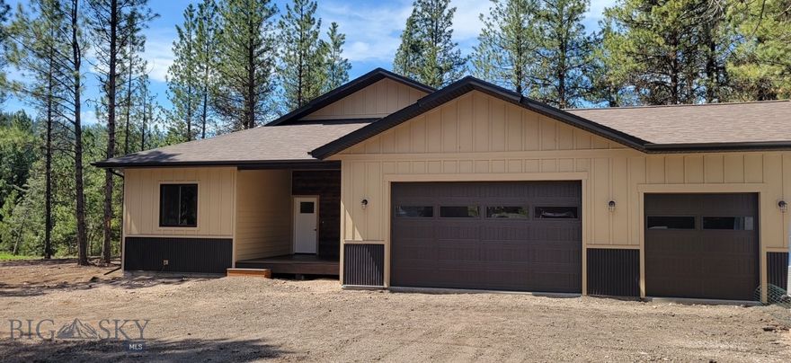 Brand New Custom Home. This thoughtfully designed 1,962 sq. ft. single-level home sits on a spacious 1.17-acre lot above the Double Arrow Golf Course. Featuring a bright, open floor plan with abundant natural light, large windows, & 10’ ceilings, this home offers both comfort & style. The living area has a cozy propane fireplace & the kitchen boasts high-end maple cabinetry, granite countertops, a breakfast bar, pantry, & stainless steel appliances. The primary suite is a private retreat with a walk-in tiled shower & glass enclosure, dual vanities, & dual walk-in closets. Two additional bedrooms & a full shared bath provide space for family or guests. Additional highlights include an oversized attached 2-car garage with ATV parking space, and a deck/patio for outdoor living. Conveniently located off a paved road with easy access to Seeley Lake, golf, hunting, & recreational trails.