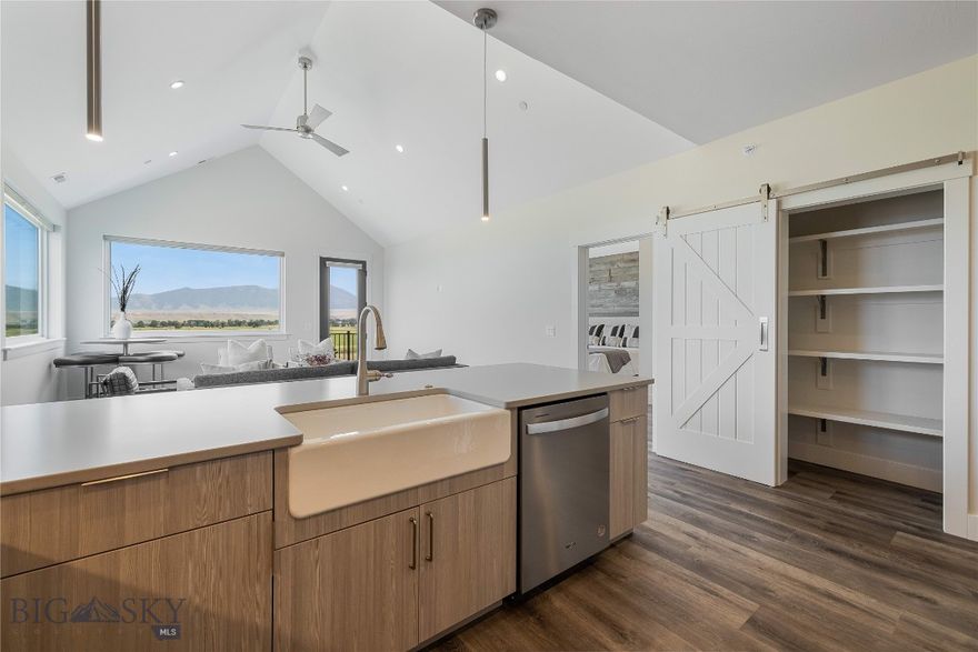 Set against the wide-open landscapes and river corridors that define the Madison Valley, The Drift at North Forty offers a rare opportunity to own new construction in the heart of Ennis. Located within walking distance of Main Street and minutes from the Madison River, these 3-bedroom, 2-bathroom residences provide immediate access to both town and open country. Each home is designed for low-maintenance living with an open-concept layout and expansive windows that frame mountain views and fill the space with natural light. Finishes are durable and clean, designed with a timeless aesthetic that complements the surrounding landscape. The interiors balance practicality and comfort, making the home equally suited for everyday living and extended stays. The walkout primary suite offers privacy and direct outdoor access, while two additional bedrooms allow flexibility for guests, family, or a home office. An attached one-car garage and a dedicated storage unit provide ample space for fly rods, skis, and other gear that comes with living in the Madison Valley. Upper-level residences benefit from elevated sightlines and broader valley views. Short-term rentals are permitted, offering owners the option to enjoy the property personally while maintaining income flexibility. World-class fly fishing on the Madison River, hunting and hiking on nearby public lands, and skiing at Big Sky Resort are all within easy reach. Yellowstone National Park and Bozeman Yellowstone International Airport are approximately an hour away, making The Drift at North Forty a well-positioned base for year-round use in the Madison Valley. *This unit is offered fully furnished*