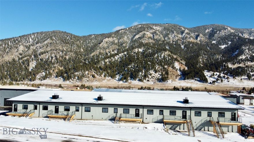 New Big Sky warehouse offering that includes the ENTIRE building- units A, B, C, D, and E as a package deal. Totaling 14,220+/-SqFt, the unit walls can be removed to open up the space to customize as needed.   This is an excellent opportunity for investors seeking income-producing commercial property in a high-demand Big Sky market. Each individual unit is roughly 1,800 SqFt on the main level and a 900 SF mezzanine with a separate rear entrance and parking. This mezzanine layout is ideal for offices above and expansive storage below for safeguarding valuable tools, equipment, and gear from Montana’s harsh elements. Each unit includes a private bathroom, ducted heat, utility sink with hot and cold water, and a 14’ roll-up door. The main level boasts a generous 13’9” ceiling height, maximizing usable space. Whether you're a contractor needing a large space for offices and equipment, or an investor looking for simple/low maintenance rentals, these units deliver.  Each unit is separately metered for propane and electricity, with convenient access just off Highway 191.