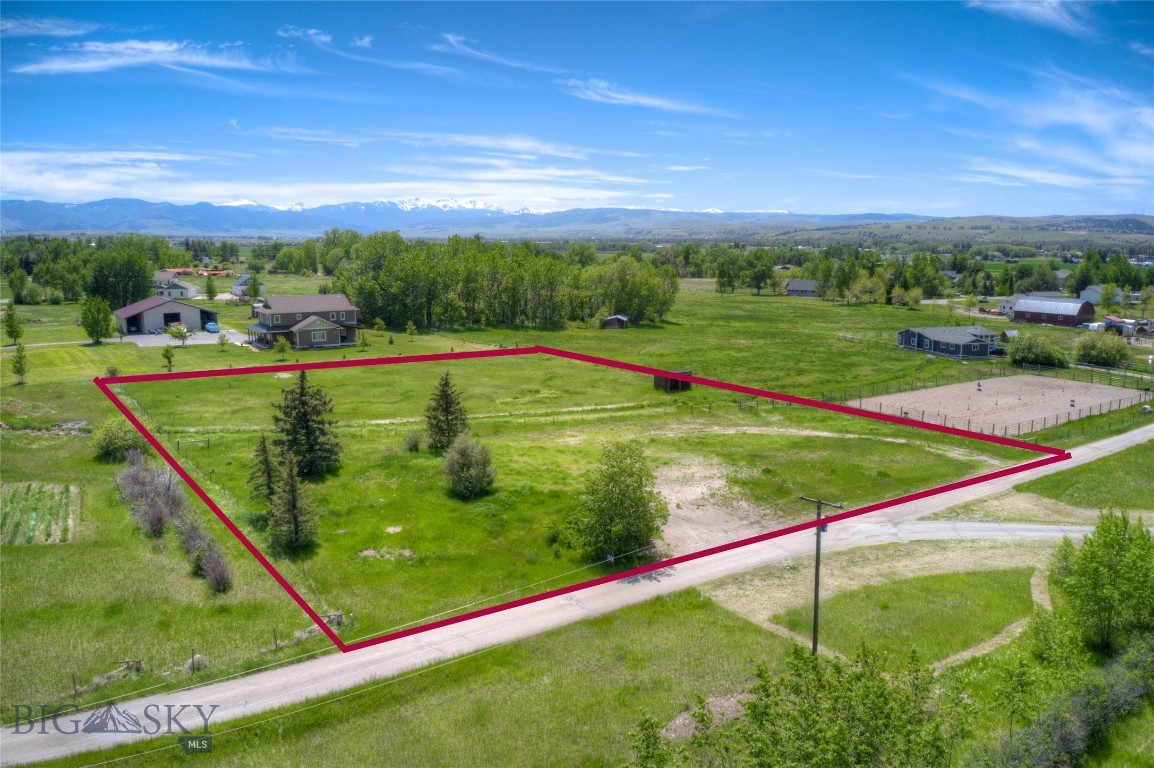 1.77 acres of vacant land convenient to Four Corners. Live the country life at this pleasing rural location. Sunny location with numerous mature trees and live water. A short drive down the country lane to a quiet rural residential neighborhood. Perfect spot to raise a family and let the kids play outside. Modular home allowed. Minimal covenants allow for shop, horses and hobby animals. Nice established pasture, seasonal ditch, fencing and loafing shed for shelter. Location offers power, phone and natural gas. Plans for preliminary residential septic permit and new well have been submitted to Gallatin County. Bring your home plans and pick a build site with mountain views.