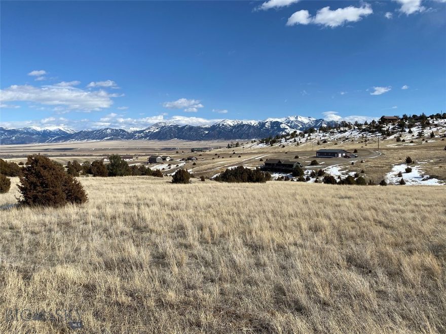 5.702-Acre Lot with Stunning Mountain Views! Nestled in the Shining Mountains area, this spacious lot offers breathtaking Madison Range views, a mix of native grasses, trees, and rock formations, and easy access via Dude Ranch Trail. Perfect for outdoor lovers, the property provides private access to trout-stocked lakes and USFS land, along with opportunities for fishing, hiking, biking, and horseback riding. Located on a county-maintained road, this lot is ideal for year-round living or a recreational getaway. HOA dues are just $200/year, with a $2,500 building fee. The adjacent 5.566-acre lot (102  MLS#400060) is also available—buy one or both!