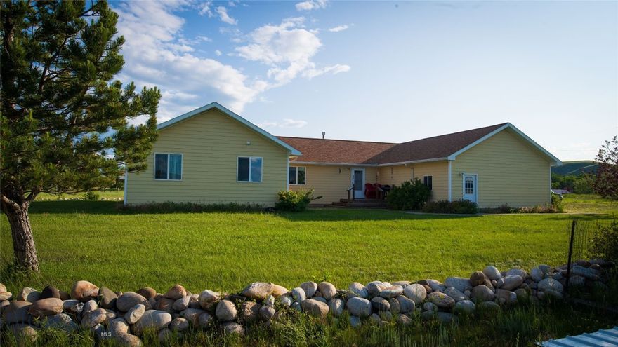 Located on 5 acres and just minutes from town, this single-level ranch-style home is ideal for families or anyone seeking a great property and a little extra space. With 4 bedrooms, 2 bathrooms, and a spacious open-concept kitchen and dining area showcasing vaulted pine ceilings, this home is designed for both functionality and comfort. Radiant floor heating throughout ensures cozy warmth during the winter months. The heated garage provides a great workshop with ample storage space along with 2 additional storage sheds in the backyard. Enjoy the mountain views from your deck with plenty of outdoor space for a garden, play area for children, shop, or even a small hobby farm. Experience the peace of country living with the conveniences of town, nearby golf course, and the Boulder River. Don’t miss the opportunity to make this beautiful property your own.