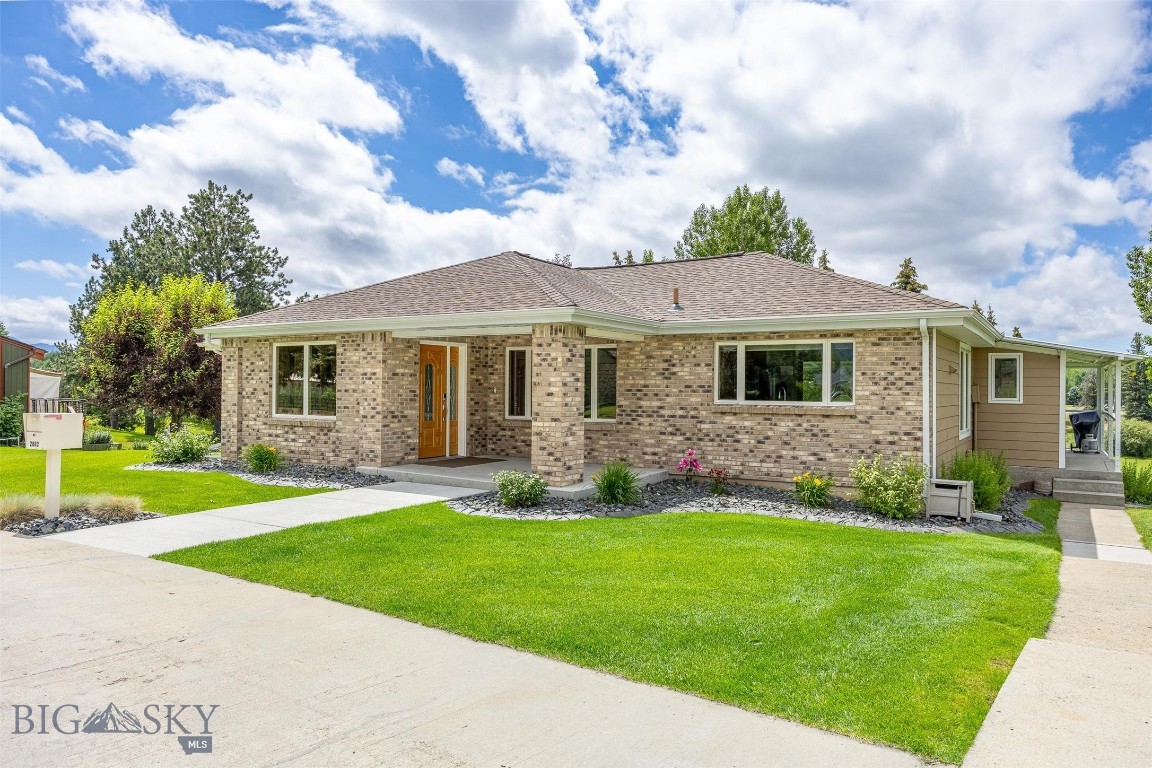 This property sits on 3/4 acre on the 4th hole of the Butte Country Club Golf Course. This pristine home has 4 bedrooms and three baths and has undergone extensive exterior and interior renovations. The long driveway in gives and estate like feel as you enter the property. A new entryway was recently added with large closets and opens into a dining area and formal living room. The kitchen is newly remodeled with cherry cabinets (soft close), quartz countertops, table and backsplash, appliances are new and include a convection cooktop. Off this is a low maintenance cement deck with new steel awning, gas fireplace. The views from here are of the 4th fairway and beyond. The lower level has a primary suite with a remodeled bathroom with dual vanities, dual shower heads and custom tile. Updates include rewiring, replumbing, corebond insulation, new heat register and new furnace, constant hot water system, three sided gas fireplace, new roof, new Anderson windows in most of house and new roof. The garage is a heated three car detached with heated shop. Under the deck is storage for golf cart and equipment. The landscaping is mature with cement curbs around shrubs and trees. The golf course provides even more landscaping with large trees that reflect the changing seasons.