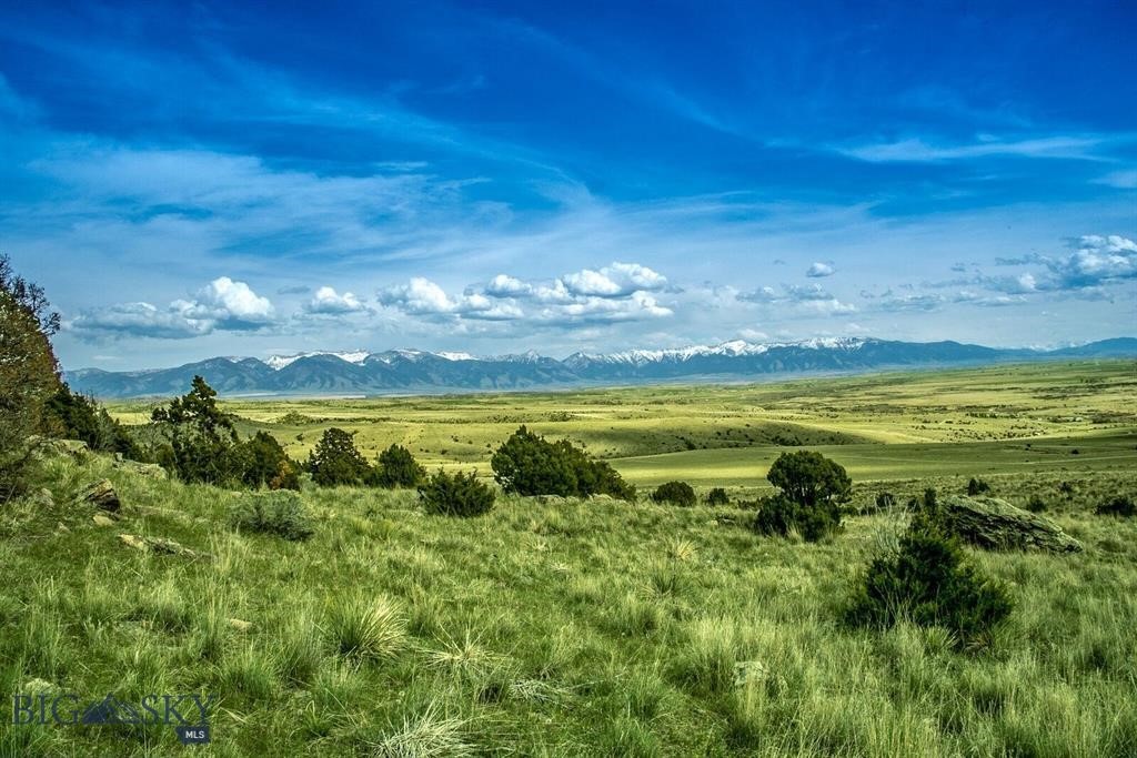 Enjoy breathtaking views with the majestic Spanish Peaks directly ahead, while the Gallatin River winds through the valley below. This expansive 20+ acre parcel offers a stunning panorama featuring seven magnificent mountains. Ideally located near the front of the Ranch with desirable southern exposure and picturesque rock outcroppings. Tucked away at the end of the road, this private hillside property offers a peaceful and serene setting. The Gallatin River Ranch neighborhood offers private walk-out river access for owners and guests. It's all HOA maintained and park features a covered picnic pavilion, BBQ's and fire pit. Located 15 minutes outside of the quaint town of Manhattan and only another 15 minutes to Bozeman. Some photos represent GRR Amenities and are not taken from listed parcel. Call your favorite Realtor for a tour today.