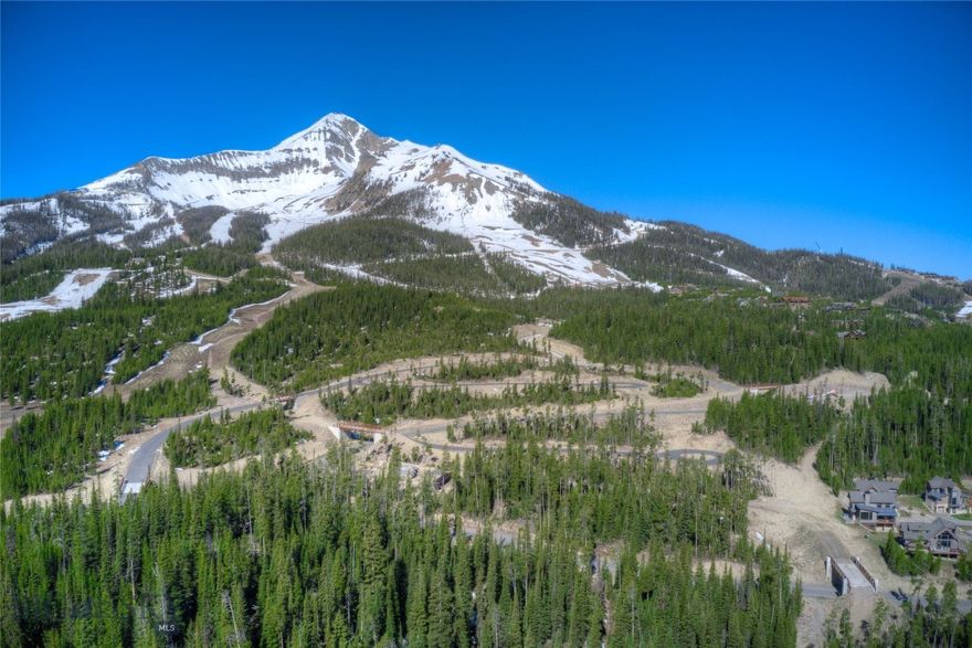 The Last Best Place is this Montana Club lot located on the slopes of America's Biggest Skiing! 0.82 acres of forested land which is Ski In/Ski Out with walk-to lift and ski tunnel adjacent to your property. This is a rare opportunity to own land on Lone Mountain.  Imagine building your dream home as your retreat; powder skiing in the winter and hiking, fishing, golfing and summer events all within a 10 minutes drive.  Big Sky is located an hour from Yellowstone Park, but the wildlife call all of this area home - deer, elk, foxes, moose and maybe a bear will be your Big Sky neighbors.  Enjoy as you and your family reconnect with the great outdoors - the perfect place to stay and play.