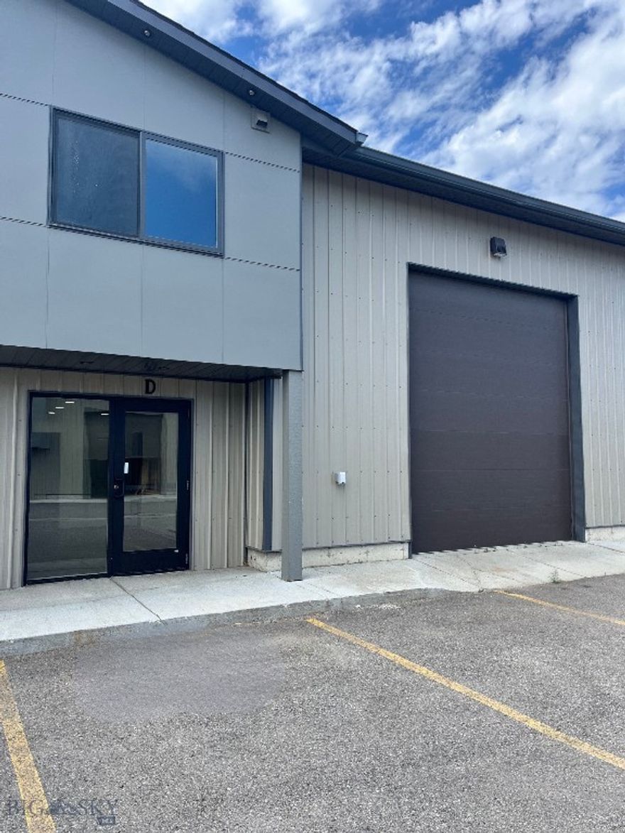 Prime warehouse space located just off Jackrabbit Lane in the heart of Four Corners—an ideal location for easy access to Bozeman, Big Sky, and Belgrade. This versatile unit features a 14-foot overhead door, 1-phase power, and a welcoming front entryway for customers. A carpeted mezzanine offers an excellent open office area, perfect for desks or collaborative workspace. The property also includes a fenced side yard with a separate man door and convenient parking directly in front of the unit. A great opportunity for a wide range of commercial uses in a high demand area.
