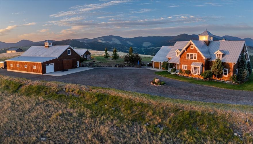 This exquisite, authentic Cape Cod-style 39.19-acre estate offers full privacy and breathtaking 360 degree; mountain views, all just 15 minutes from downtown Helena. A spacious foyer welcomes you into a beautifully designed 3-bed, 4.5-bath home featuring a dedicated office, gourmet kitchen with professional-grade gas range, granite countertops, and walk-in pantry. The open-concept dining and living areas are anchored by a striking wood-burning fireplace with raised hearth and rustic mantle. Large windows frame dramatic vistas throughout the home. An enclosed porch with flagstone floors and wood stove offers a cozy retreat for year-round entertaining. Refined rustic details include wide plank cherry flooring and exposed beams. The expansive primary suite boasts its own wood stove, private balcony, large walk-in dressing room, and a luxurious bath with oversized claw foot tub, double-head shower, Carrera marble counters, and separate vanity. A 2,880 sq. ft. fully equipped shop includes a kitchenette, full bath, 3-phase power (220/400), insulated roll-up doors, 7.5 HP air compressor, 1-ton monorail crane, and welding-ready setup. Above, a 12' x 16' space is plumbed for a future guest suite or office with kitchen, bath, and laundry. Lock and go with security features including grade 8 camera video monitoring system with remote capability and high-speed Internet through Montana Internet. A true Montana retreat blending elegance, function, and natural beauty.
