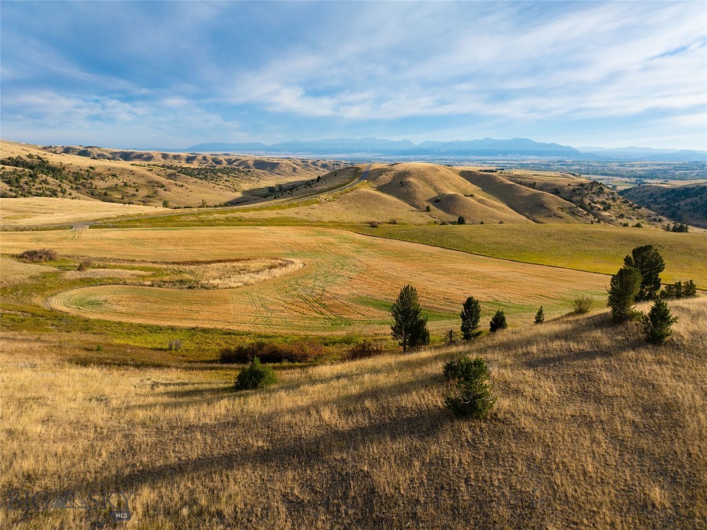 Rare opportunity! Secure your slice of Montana paradise at TBD Stampede Trail, nestled within the exclusive, gated Montana Ranch. This exceptional acreage offers ultimate privacy and stunning mountain and Gallatin Valley views. Horses are welcome! Montana Ranch is a meticulously planned community that harmonizes luxury living with environmental preservation. Enjoy the security of a gated entrance, paved roads, and incredible 360-degree vistas. This specific parcel on the southern border adjoins the vast Flying D Ranch, ensuring protected and unobstructed views – watch for the roaming bison! Amenities abound with a community horse barn, corrals, and 10 miles of private hiking/riding trails. Adventure calls from your doorstep: world-class fishing on the Gallatin (5 min), Madison (25 min), and Yellowstone (45 min) Rivers. Skiers rejoice with Big Sky Resort and Bridger Bowl just 45 minutes away. Local dining in Gallatin Gateway is minutes from home, and both Bozeman Yellowstone International Airport and vibrant Downtown Bozeman are an easy 25-minute drive.
Don't miss out. Contact your agent today for a showing!
