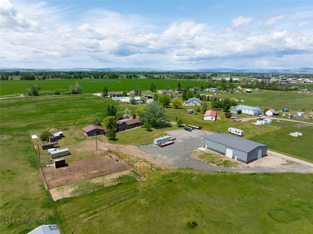 Sellers are motivated!! Come tour this hard to find small farm with a recently built 50'x80' shop. 4.85 acres with very light covenants, close to town all set up for horses and chickens. Large covered back patio with natural gas and TV hookups. The kitchen has waterproof flooring, granite counter tops and lots of cupboard space. The main living room is bright and open with a vaulted ceiling and a beautiful, unique stone fireplace with a gas insert. There is a Den/office/tv room in basement for all your hobbies or extra entertaining space. This home offers a primary bedroom with an ensuite, 2 more bedrooms plus 2 more bathrooms. Under ground sprinkler system for the lawn area. Two car detached garage space. 30' X 30' barn/wood shop with a table saw that stays with the property, loafing shed, and garden shed. Two wells, one for the house and one for irrigation. The irrigation well is not in use, pump, pipe, and pressure tank are in the barn. The recently built, heated 50x80 shop has 16' walls with 2 1/2 spray foam insulation with four 14'x12 doors for easy access. The shop has multiple 110 and 220 outlets, central drain with grate, exterior RV hookup, hunting room, and heated bathroom.