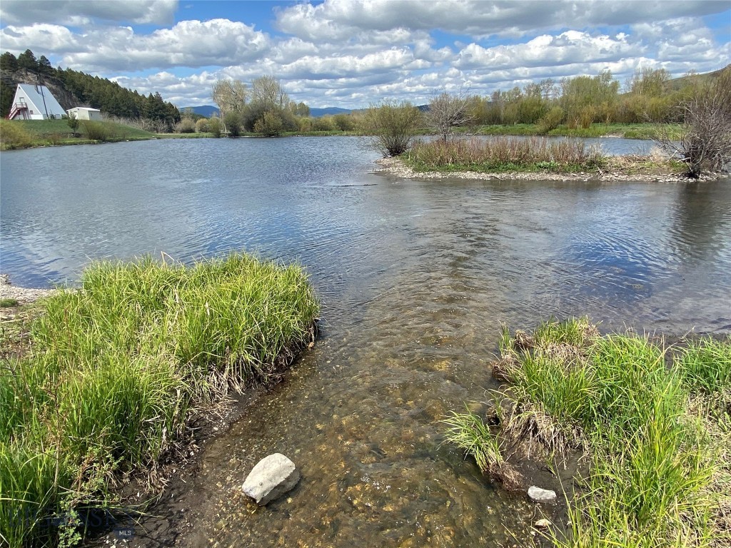 Are you looking for that unique piece of Montana land? Grab a couple of your friends and come enjoy this summer hideout with fishing pond on site. Ideal beautiful mountain setting, featuring a spring fed creek and many trees. Buildings include a larger gathering space with commercial kitchen, 3000 sf chapel with amazing architecture, high ceilings, fireplace and stage. Bath house with attached garage/workshop, laundry and storage area, 5 rustic dry cabins and an additional cabin with half bath. Tons of square footage to use as your heart desires.
10 RV spots with water and power hook ups. 3 bedroom, 2 bathroom older manufactured home that is not on a permanent foundation, built in 1984. Live here while your building your dream home. Water rights out of Hurd Creek along with 2 wells on site.
Easy access directly off the hiway, yet secluded. Located only 10 minutes to public land for ultimate hunting, 4 wheeling, snowmobiling, hiking and any outdoor recreation.
Invite your friends and fishing buddies to drop a line in the pond and catch some dinner, while enjoying the most memorable sunset. This is an amazing opportunity to make this paradise your own, with no close homes. No covenants! Bring your dream and develop this into a private oasis, a couple of family members and you can have a family retreat, event venue for private concerts or weddings, luxury resort or expand into bustling RV Park. Some of the sellers personal property may be negotatiated.
Schedule your private tour today, as the pictures don't do this place justice.