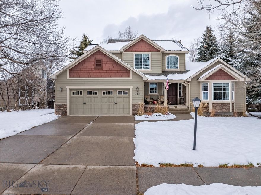 Nestled in the highly coveted Westfield Subdivision, this distinguished Southside residence offers unmatched proximity to Sacajawea Middle School, Morningstar Elementary, Montana State University, and a scenic trail network that connects seamlessly to Downtown Bozeman. Set on an expansive 11,049 sq. ft. lot backing to community greenspace, this 4-bedroom, 3.5-bath traditional Craftsman home marries timeless architecture with thoughtful modern enhancements.
A dramatic two-story, light-filled entry sets the tone for the home’s refined interior. Just beyond, a gracious step-down living room/parlor provides an elegant space for quiet conversation or elevated entertaining. The main level showcases rich hardwood flooring, arched openings, and architectural columns that lend definition and sophistication to each room. The beautifully updated kitchen features stainless steel appliances, modern finishes, and generous space for casual dining. Adjacent, the warm and inviting family room is anchored by a striking river rock gas fireplace—an ideal gathering area for everyday living.
The upper level is dedicated to rest and retreat. The luxurious primary suite captivates with vaulted ceilings, expansive windows framing mountain views, and a spa-inspired bathroom appointed with a soaking tub, glass shower doors, dual-sink vanity, and walk-in closet. Two additional bedrooms and a full bath complete this thoughtfully designed floor.
The finished lower level extends the home’s livability with bamboo flooring, a spacious daylight family room, a dedicated bedroom and full bath, and a versatile office/exercise room. The oversized laundry room comes complete with extensive built-in cabinetry and shelving to accommodate gear storage, hobbies, and organization with ease. 
The 3-car garage provides exceptional storage and functionality.
Outside, the private, fully fenced backyard feels like a curated outdoor sanctuary. Mature landscaping, a Trex deck, and a stunning newly built patio crafted from rustic timbers create an extraordinary setting. Stone work and a fire pit complete the space, offering an inviting backdrop for intimate gatherings or relaxed evenings under Montana’s open sky.
Impeccably maintained and beautifully appointed, this exceptional Southside home offers a rare combination of craftsmanship, comfort, and luxury.