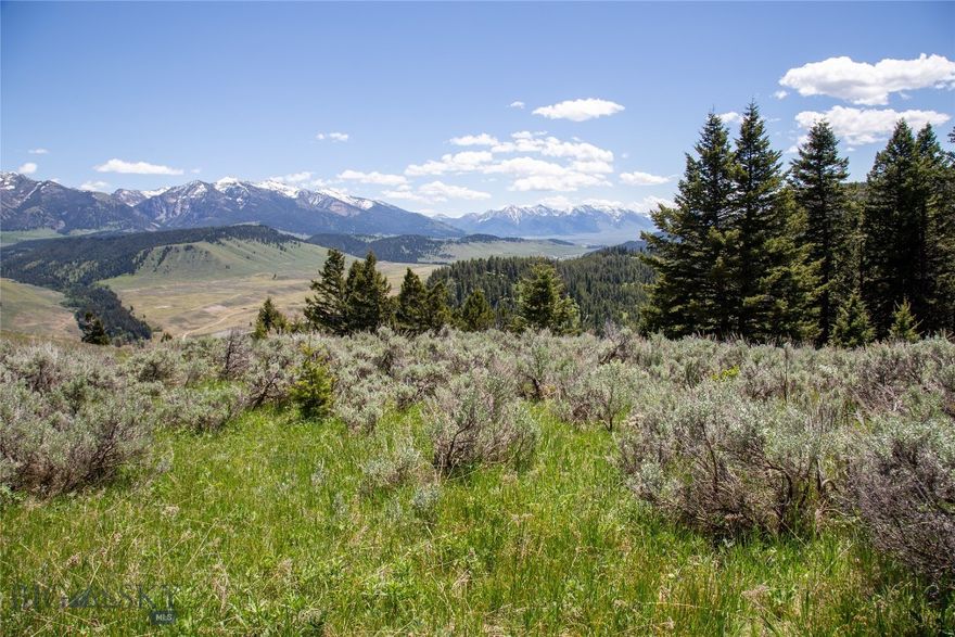 Experience breathtaking views from this 5.75 acre lot in Sun West Ranch. This sunny lot has a homesite completely shielded by aspens and Douglas Fir trees to the north but, open to the tremendous views to the south. It overlooks Standard Creek drainage and National Forest service with the views extending beyond the Madison River and to the dramatic mountain peaks further south and east. It is located in the upper meadow and you will be sure experience the wonders of alpine wildflowers, summer showers and the resulting, magnificent rainbows. The ranch includes access to 3 miles of the Madison River, several stock spring fed ponds, an equestrian area, and miles of hiking or riding trails. Escape to the wild Montana mountains in this gated ranch community and be as secluded or connected as you choose