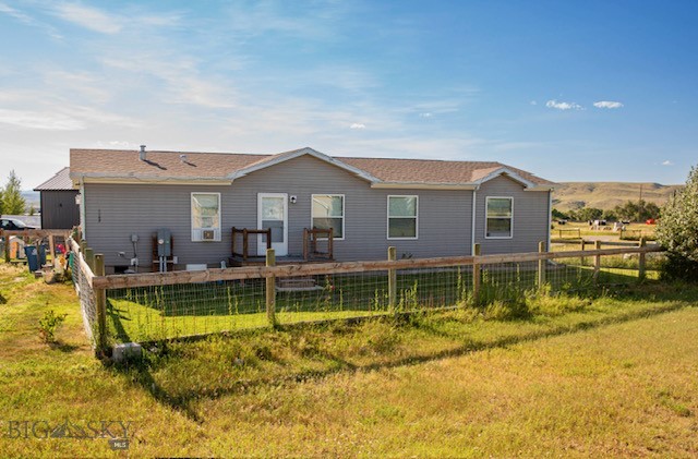 Welcome to this beautifully maintained 2023 manufactured home situated on a spacious 10,994 sq ft lot in Big Timber. Offering 1,568 sq ft of comfortable living space, this home features 3 bedrooms and 2 bathrooms, including a large master suite with an oversized closet. Enjoy Montana living with a porch and deck, fully fenced yard, and underground sprinklers to keep your outdoor space green and inviting. Each bedroom has large closets providing plenty of storage. The home also includes a convenient laundry area and has been meticulously cared for. Don't miss out on this move in ready property with modern finishes, ample space, and outdoor areas perfect for relaxing or entertaining.