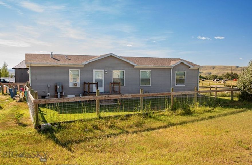 Welcome to this beautifully maintained 2023 manufactured home situated on a spacious 10,994 sq ft lot in Big Timber.  Offering 1,568 sq ft of comfortable living space, this home features 3 bedrooms and 2 bathrooms, including a large master suite with an oversized closet.  Enjoy Montana living with a porch and deck, fully fenced yard, and underground sprinklers to keep your outdoor space green and inviting.  Each bedroom has large closets providing plenty of storage.  The home also includes a convenient laundry area and has been meticulously cared for.  Don't miss out on this move in ready property with modern finishes, ample space, and outdoor areas perfect for relaxing or entertaining.