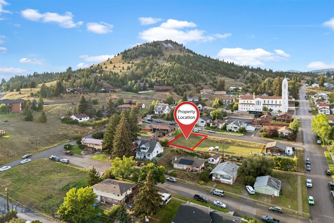 Build your vision in the heart of Uptown Butte! This mostly flat residential lot offers a prime location within walking distance to Montana Tech. Enjoy a front-row seat to the famous Big M and fireworks each 4th of July, making this a rare opportunity for both convenience and charm. Public utilities are available, and the lot provides plenty of flexibility for a future home or investment. This lot is being sold individually, but an adjoining lot is also available—perfect for those looking for extra space or investment potential.