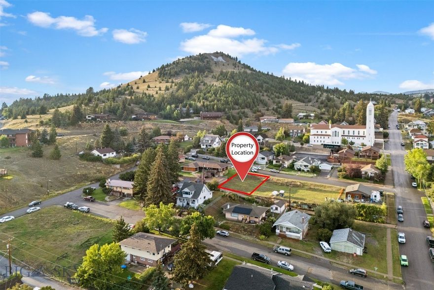 Build your vision in the heart of Uptown Butte! This mostly flat residential lot offers a prime location within walking distance to Montana Tech. Enjoy a front-row seat to the famous Big M and fireworks each 4th of July, making this a rare opportunity for both convenience and charm. Public utilities are available, and the lot provides plenty of flexibility for a future home or investment. This lot is being sold individually, but an adjoining lot is also available—perfect for those looking for extra space or investment potential.