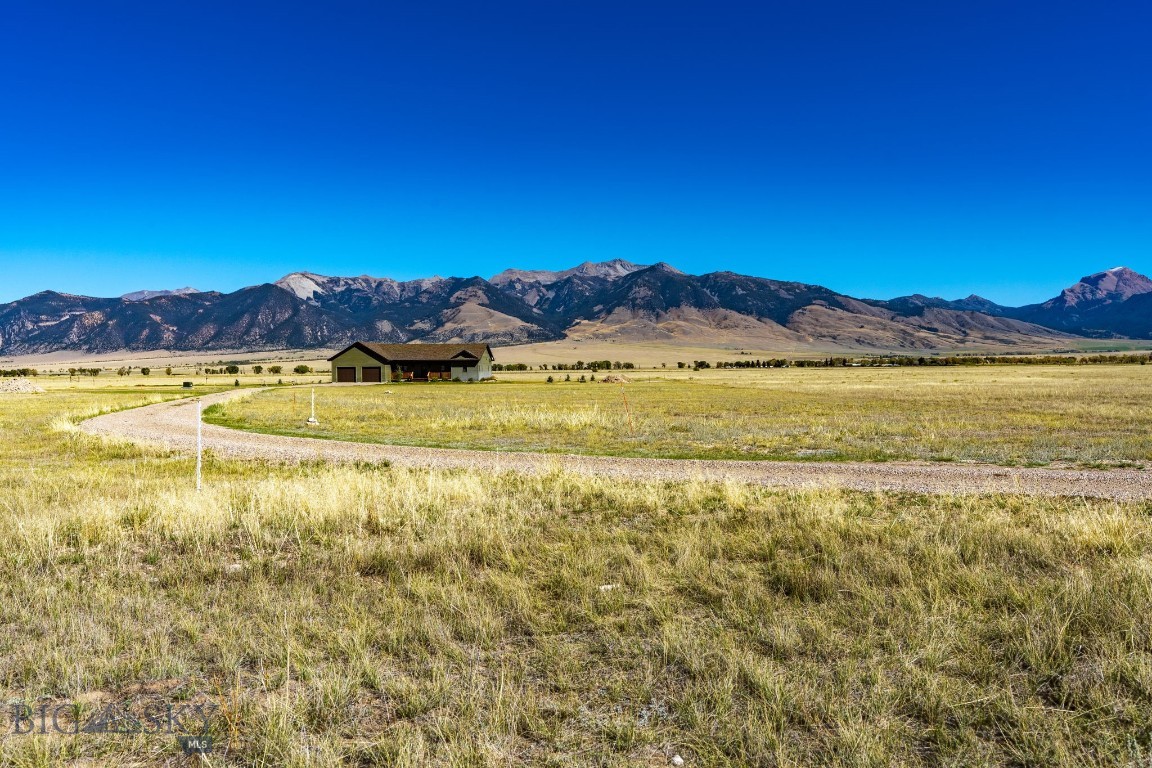 Welcome to Lonesome Dove Ranch in Cameron, Montana—where 20 acres of level, buildable land meet breathtaking views of the Madison Range, Sphinx Mountain, and the Gravelly Range. This flat, rectangular parcel offers an ideal canvas for your dream home, barn, or horses, with wide-open skies and native prairie grasses all around. Modern conveniences are in place with underground power and fiber optics available, and HOA-maintained roads ensure easy, year-round access. Outdoor recreation is at your doorstep, from world-class fishing on the Madison River to nearby hunting, hiking, and Yellowstone National Park. With reasonable covenants and low HOA dues, this property combines Montana freedom with peace of mind—a true Big Sky opportunity.