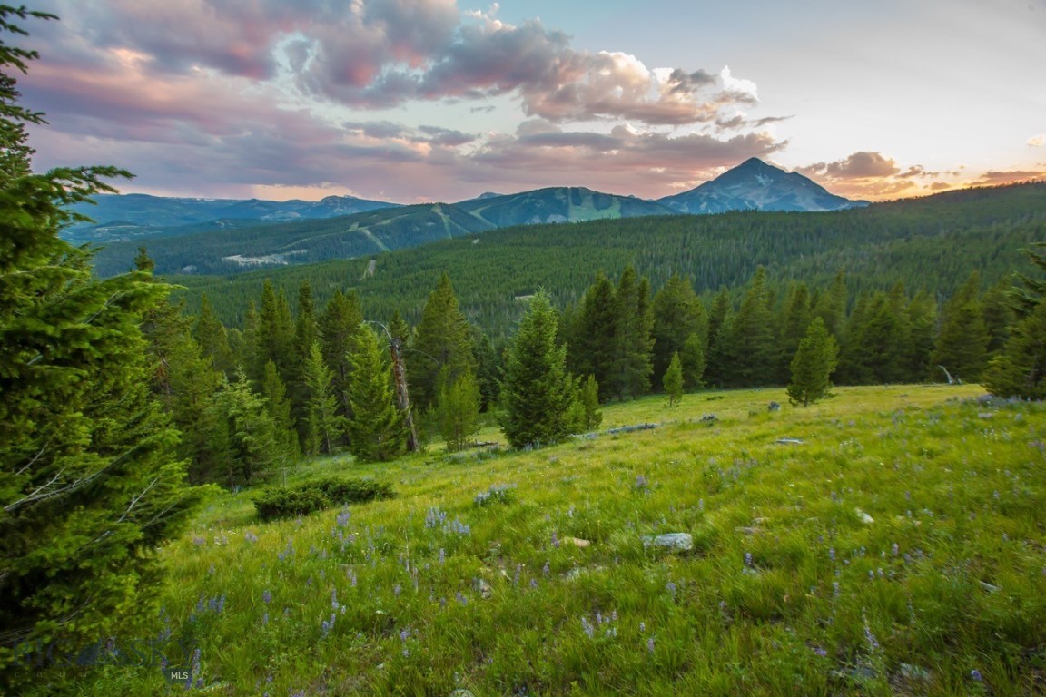 A timeless legacy property in the heart of Big Sky – 320 Acres of Unparalleled Beauty. Nestled in the coveted North Fork corridor of Big Sky, Montana, this extraordinary 320-acre estate offers an exceptional combination of natural grandeur, privacy, and proximity. With sweeping, unobstructed views of the Spanish Peaks, Gallatin Range, Lone Mountain, and Pioneer Mountain, the landscape is as breathtaking as it is rare.
This expansive property is bordered by thousands of acres of National Forest, providing direct access to an extensive network of private trails for hiking, biking, and Nordic skiing. The land itself is a rich mosaic of alpine meadows, old-growth forests, and rolling topography—ideal for a private estate, conservation refuge, or refined development opportunity.
The majority the property (298 acres) is zoned RCSF 20, which could provide someone the opportunity to create more homesites or consider a conservation easement. The parcel offers a balance of flexibility and long-term preservation potential. All of this is just minutes from the energy of Big Sky’s Town Center and world-class amenities at the base of Big Sky Ski Resort.
A singular offering in scale and setting, this property represents one of Big Sky’s last great private landholdings—an enduring legacy for generations to come.