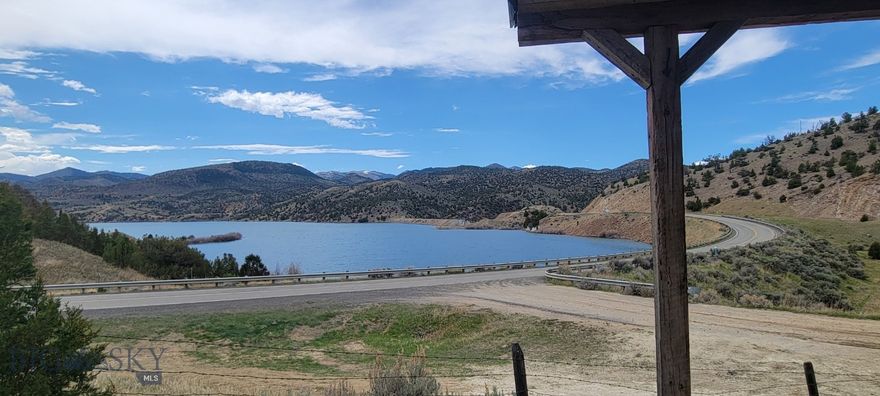 New Pricing - A Great Cabin with an amazing view of the Ruby Reservoir just out Alder Montana. So many and diverse outdoor activities are so close to this property - Hunting for Garnets along the banks of Ruby Reservoir to riding your side-by-side to the nearby BLM and Forest Service.  If you want to hunt big game this property is in just the right spot.  Fly fishing the Ruby River, the first of 3 fishing accesses between this property and Alder, is just 1/2 mile from home, Water ski, jet ski, wind surf and lake fishing all available just out the front door.  Winter activities include Ice Fishing and snow mobiling. This Cabin has approx. 820+/- sf and 270+/- s.f of covered deck for outdoor living space with pretty amazing views..  Each of the 2 bedrooms have currently bunk beds with the sofa pull-out bed in the living space for your guests.   Seller will include most furnishings, bedding, dishes, etc (no head mounts or personal possession) with a full price offer.  With no covenants so no restriction on Short Term rentals  for those want to use this property occasionally.
There is plenty of space, fenced in below the cabin with gravel to water hydrant and plenty of room for your kayak, canoes, side-by-sides or parking for large gatherings.  Call for your showing today!