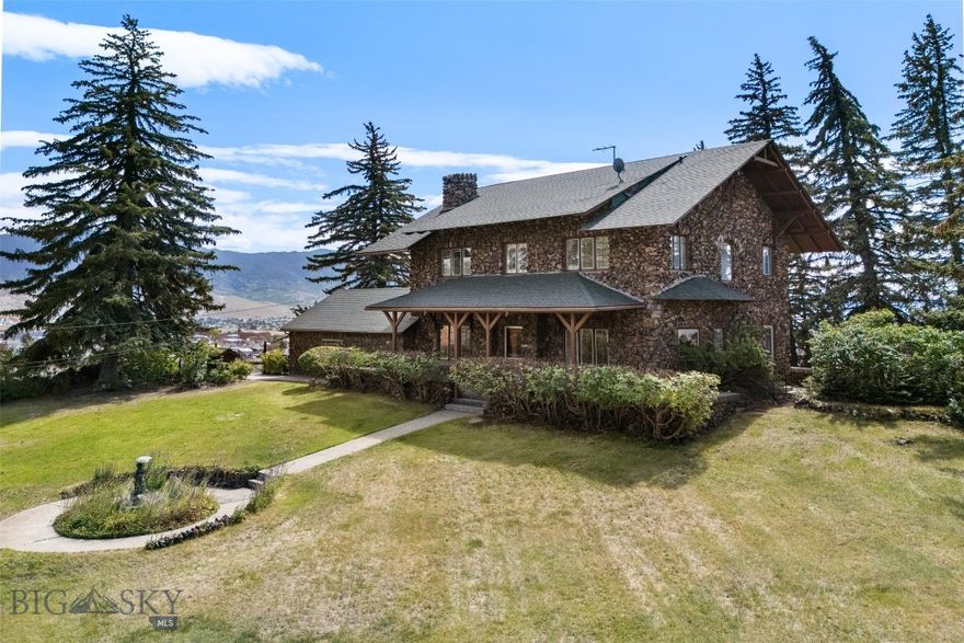 Once-in-a-lifetime opportunity to own one of Butte’s most iconic properties. Known affectionately as “Lover’s Roost,” this historic estate sits atop 2.19 acres on a full city block, offering commanding views in every direction. Constructed with stone from the Travonia Mine, this home showcases old-world craftsmanship and timeless elegance.  Featuring several Juliet balconies, a large shaded deck perfect for relaxing or entertaining, and multiple fireplaces—including one in the den, living room, and another in a spacious bedroom—this property blends comfort and character throughout. Wildlife lovers will enjoy frequent visits from a local family of deer that roam the grounds.  Located directly across from St. James Intermountain Health, this unique property is private yet central. A rare chance to own a grand piece of Butte’s architectural and cultural history.