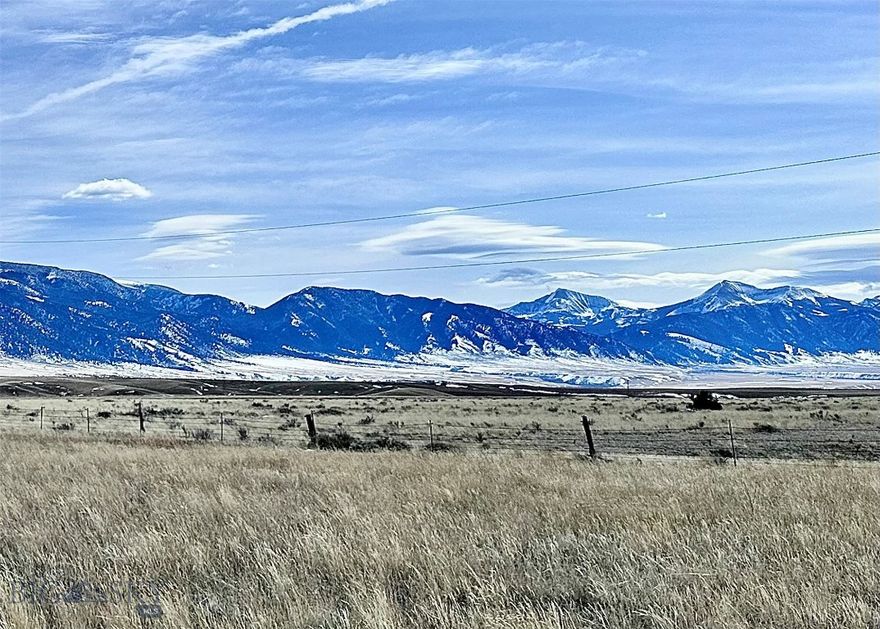 Build your dream home to take advantage of 270+/- degrees of unobstructed views including the Madison Mountains almost to the Idaho border, the Tobacco Root Mountains to the west, and the Revenue to the north.  This end of the road 20+ acre parcel will give you extra privacy as it adjoins 3 larger ranches on it's southern and eastern borders.  There are multiple buildings sites and you may wish to consider building to the eastern side of the property overlooking an interesting draw adding variety to this mostly level land.  The property is perimeter fenced on the north and south sides making it fairly easy to add more fencing/cross fending to pasture your animals.  There are water rights in the Seller's name that will convey at closing (Buyer is responsible to verify).  There is power to the cabin on the adjoining lot to the west.  Possible owner financing for a qualified Buyer.  Covenants help to protect your investment.  Don't miss this rare opportunity to own a great parcel of land in Montana - they aren't making any more of it!