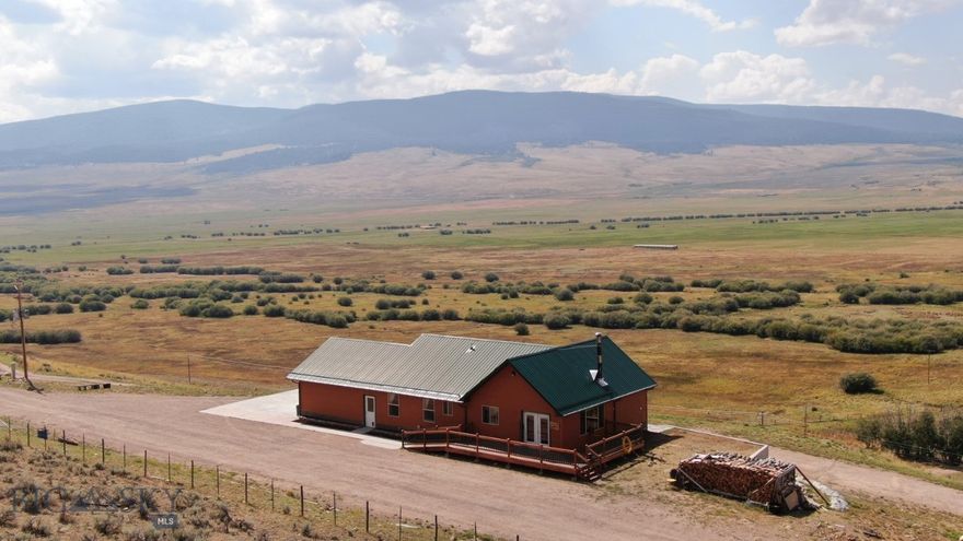 This rental dwelling or residence is perched high overlooking Grasshopper Creek and miles of timbered high country in the Beaverhead Deerlodge National Forest, boasting multiple high peaks and miles of public lands trail access.  Spectacular, panoramic mountain views, and close proximity to Maverick Mountain Ski Area and Elkhorn Hot Springs.
Lovely 2,816 square feet home, 4 bedrooms & 2 baths with heated 2 car garage on 8.13 acres with detached greenhouse.  **No zoning / covenants.**  Possible owner financing with significant down payment.  
Open floor plan with vaulted ceilings and large windows to take-in the panoramic views.  Built in 2008.  
Property may be used as short-term or long-term rental, VRBO, for outfitter business, or simply as a comfortable, well-equipped home with handicapped access, flexible and private accommodations.
Located on Pioneer Mountains Scenic Byway - great access off highway 278 west of Dillon.  Close to the Beaverhead, Big Hole and other famous Montana blue ribbon fisheries.
Well and electrical , and taxes are shared by both residence and business;  if Buyer purchases home without the business, Seller will provide power and water to Buyer at no charge until Seller completes new well and establishes separate electrical meters.  Trash is carted to a local dump site 7 miles east.  Property listing deemed accurate;  however, buyers are encouraged to verify accuracy of all details.