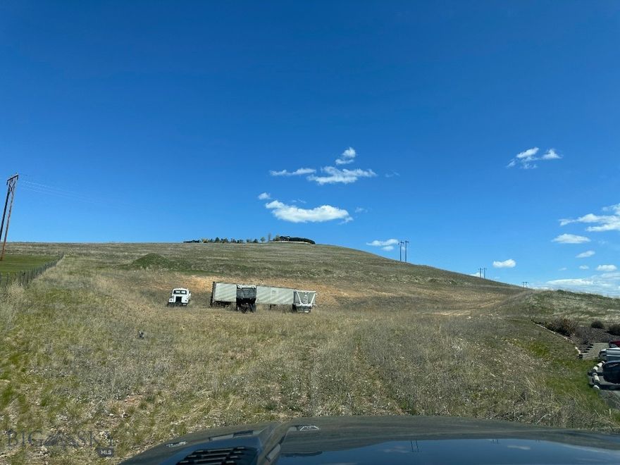 50+ Acres in town development property. Great investment. Massive quantity of high-quality gravel on the east parcel. 2 separate parcels Power is in. Easy access from I-90. Commercial and multifamily or single-family development potential. Utility easements in place for future development. Rolling terrain with incredible views to the south. Rare large tract development property. Preliminary development engineering complete and available for review. Seller would consider selling the parcels separately, call for details.
