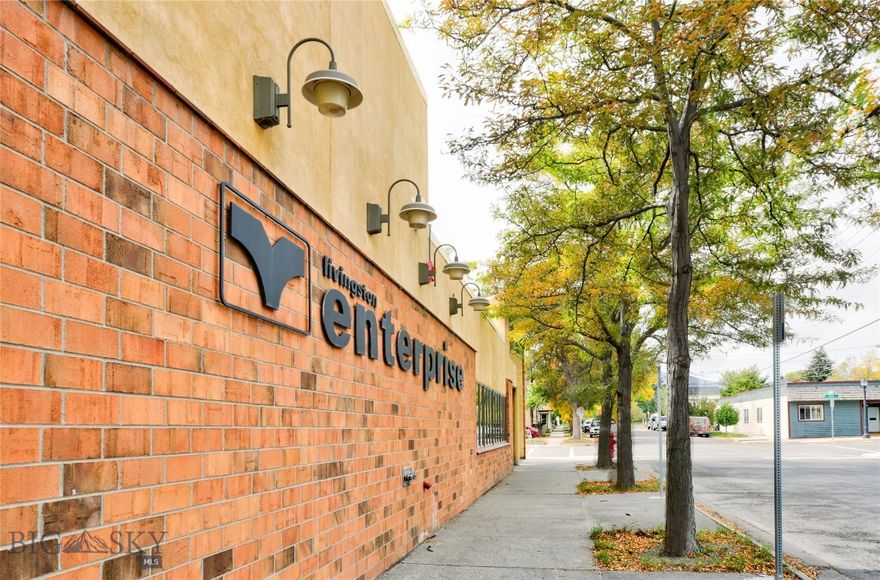First time on the market for this very well built building that has over 5,000 square feet of office space and over 5,000 square feet of high ceiling warehouse/shop space with an ideal location on Livingston's Main Street. The lot is over 25,000 square feet providing good combination of both street and off street parking. A creek meanders behind the building and there is a loading dock to the shop warehouse space.
The office portion has private offices, conference room, open space and two dark rooms. The office has central heat and air and has a sprinkler fire suppression system The shop/warehouse has gas space heaters and is cooled by two swamp coolers and also has a sprinkler fire suppression system. 
Building site was excavated and gravel filled and extra footings exist from the office area for future expansion if needed. This is a very unique and versatile property that would lend itself to a variety of uses. Bring your ideas and take a look.