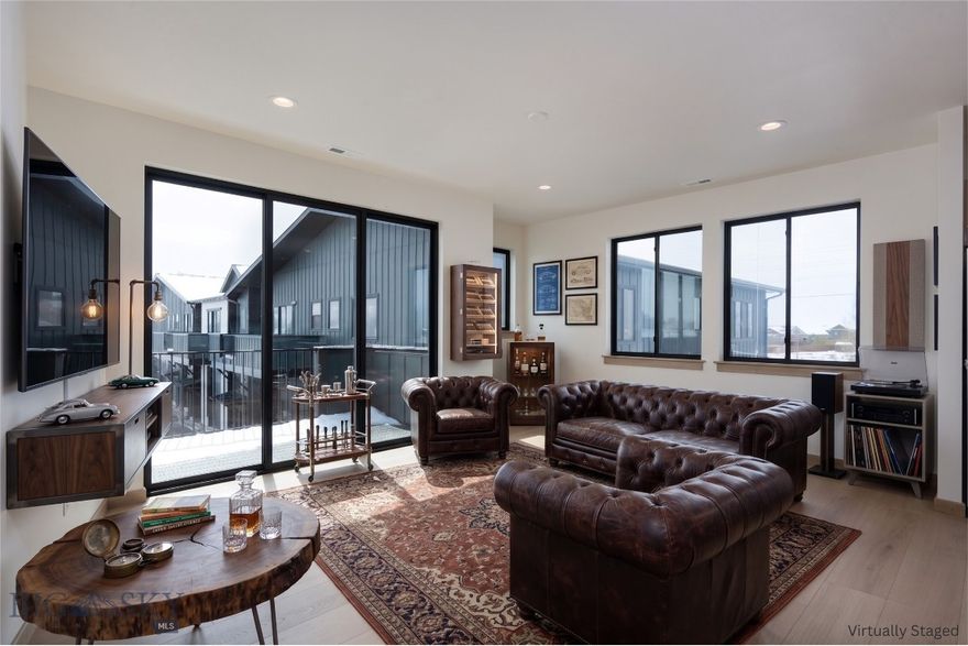 Introducing the Fremont Flex Plus at Fremont Square: The Ultimate Balance of Scale and Sophistication.
Elevate your expectations with 2607 Fremont, featuring the newly released Fremont Flex Plus plan. Thoughtfully engineered for those requiring exceptional space to both live and work, this 2,797-square-foot property offers a rare combination of industrial-grade utility and modern residential luxury.
The Main Level: Unrivaled Professional Utility-The ground floor features an impressive 1,349-square-foot shop designed with soaring ceilings and oversized 14-foot garage doors. This expansive, climate-controlled space is perfect for secure storage of large-scale vehicles, trailers, or specialized inventory. Whether utilized as a professional-grade workshop or a secure vault for recreational gear, the flexibility is ideal. 
The Upper Level: Refined Modern Living-The living quarters offer nearly 1,450 square feet of bright, open-concept design. The spacious kitchen—complete with a large center island and abundant cabinetry—flows seamlessly into the dining and living areas, creating an ideal environment for both quiet relaxation and upscale entertaining. Two generous bedrooms and two bathrooms provide comfort and privacy, while the large private deck captures the quintessential Montana setting with unobstructed views of the Bridger Mountains.

Strategic Location & Investment- Situated in a high-growth corridor with immediate access to Jackrabbit Lane, I-90, and the Big Sky gateway, the Fremont Flex Plus is more than a residence—it is a strategic asset. Experience the rare synergy of a true luxury home paired with substantial, multi-use workspace, all integrated into one seamless owner experience.