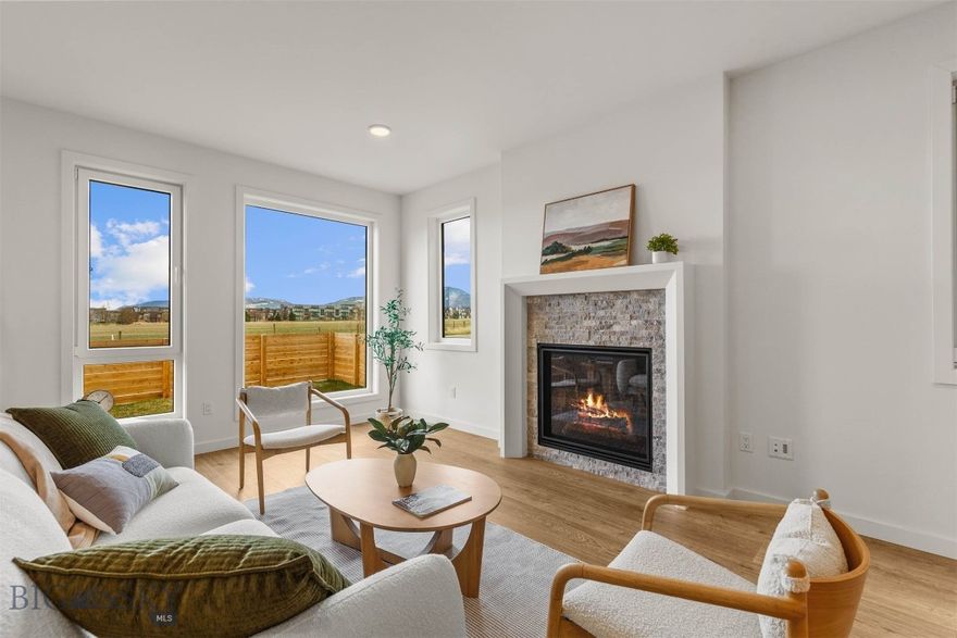 Where thoughtful design meets effortless Montana living—welcome to the newly unveiled Fika 3 condo at Gran Cielo-an exceptional, never-before-released design in the highly desirable Gran Cielo neighborhood. This brand new 2-story condo offers 2,039 sq ft of beautifully curated living space, complete with a rare fenced front yard and large covered patio for your outdoor entertaining (prewired for a hot tub/sauna). Step inside to a main level that balances style with functionality, featuring a spacious kitchen, large island, wood Lectus cabinetry, quartz countertops and an inviting living room with a gas fireplace. A powder bath, mud room with built-ins, and laundry room add convenience and flow to the main level, while Innotech euro-style windows fill the home with warm natural light. Central heat and air conditioning bring year round comfort. Upstairs, the layout continues to impress with a generous primary bedroom and en-suite bathroom, two guest bedrooms, a full guest bath, and an additional flex space perfect for an office, lounge, or play area. Modern, bright, professionally designed, and thoughtfully crafted, this new Fika 3 plan blends clean design with everyday comfort—an opportunity not to be missed in Gran Cielo.