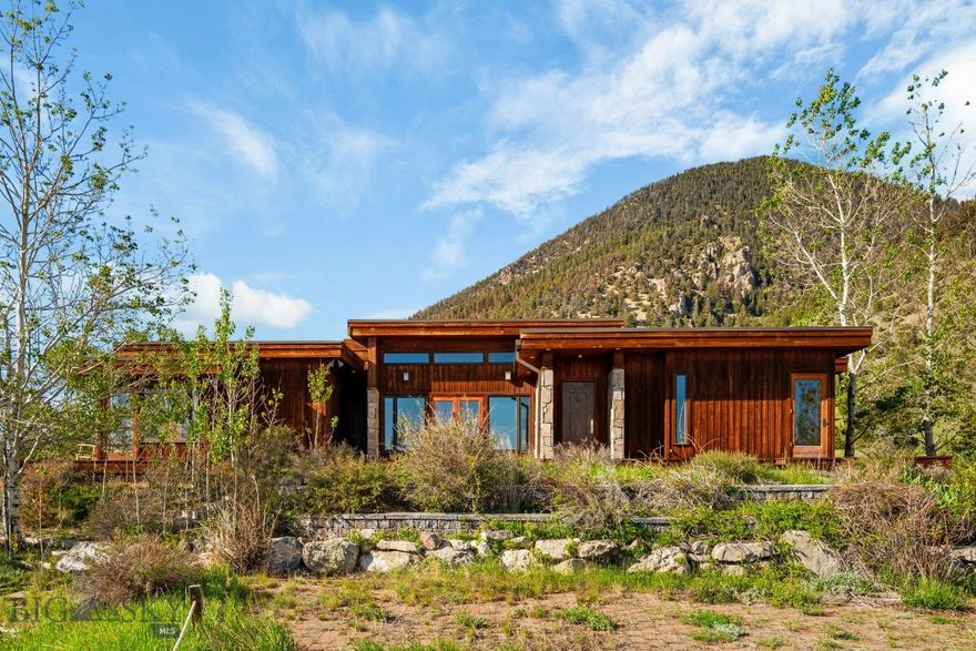 Nestled in the heart of one of Southwest Montana’s most coveted and scenic regions, MJS Ranch offers an exceptional opportunity to own 1,416± acres in the stunning Madison Valley, just outside Cameron and 20± minutes from the charming town of Ennis. This end-of-the-road property is bordered by 2.5± miles of National Forest and wilderness area, ensuring unmatched privacy and direct access to thousands of acres of pristine wilderness. From nearly every vantage point on the ranch, breathtaking panoramic views stretch across the Madison Valley and out to the towering peaks of the surrounding mountain ranges, creating a majestic and inspiring backdrop. The world-famous Madison River, offering blue ribbon trout fishing, is just 7± miles from the ranch entrance at the Varney Bridge Fishing Access.
The ranch is graced with over 2 miles of Tolman Creek and half a mile of Mill Creek, providing excellent water resources for stock and wildlife. The land is well-suited for productive agricultural use with approximately 100± acres under pivot and 50± acres under flood irrigation. It supports a viable cattle operation with capacity for 80 pairs, bolstered by two additional summer grazing leases.
Improvements on the property include a beautifully crafted 3,100± square foot main home, featuring three bedrooms, three and a half bathrooms, a home theater, and an attached two-car garage with ample storage. The secondary residence, a 896± square foot cabin, offers four bedrooms and two bathrooms, making it ideal for guests or a manager’s quarters. The ranch is well-equipped for equestrian and agricultural use, with an indoor riding arena housing seven stalls, a tack room, a barn, a hay shed, an equipment shop, and corrals.
Located just over an hour from Bozeman Yellowstone International Airport and Yellowstone National Park’s West Entrance, this rare offering balances serene seclusion with excellent access to Montana’s world-renowned amenities and landscapes.