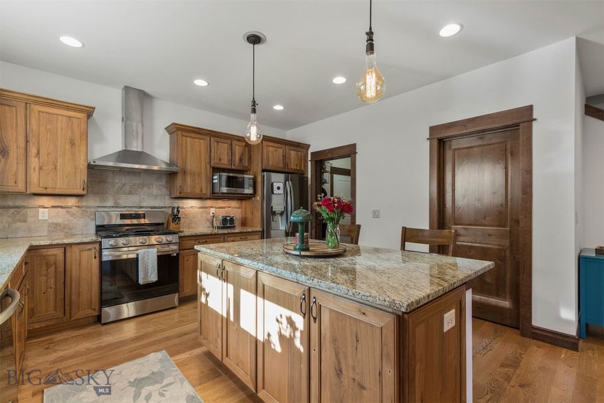 Welcome to this classic and beautifully maintained 4-bedroom, 2.5-bath home located in the sought-after Meadow Creek neighborhood on Bozeman’s desirable South Side. Thoughtfully designed with abundant natural light, the main-level living space features a spacious living room accented by wood floors, solid alder trim and doors, and an integrated home audio system that enhances everyday living. The inviting kitchen is a standout, offering granite countertops, rich walnut cabinetry, and an ideal layout for both cooking and entertaining. The main-level primary suite provides comfort and privacy with its large footprint, separate tile shower and soaking tub, dual sinks, walk-in closet, and stylish tile flooring. Upstairs, you’ll find three additional bedrooms, one that could make an ideal secondary living area, home office, playroom, or media space. Completing the second level is a guest bathroom with dual sink vanity. The new carpet throughout the home makes the home refreshed and move-in-ready. Outside, the fenced yard offers room to relax or play, while the three-car garage provides ample parking and storage. With its warm finishes, functional floor plan, and ideal location close to parks, trails, and schools, this Meadow Creek gem is ready to welcome you home.