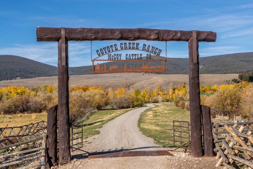 Nestled in the heart of Montana ranch country near Grant, the Coyote Creek Ranch encompasses 2,802± deeded acres surrounded by breathtaking views of the Pioneer Mountains. Steeped in history, this region of Horse Prairie is where the Lewis and Clark Expedition met Sacagawea’s Lemhi Shoshone people in 1805—an area long valued for its open grasslands, water, and early ranching heritage.
Coyote Creek Ranch is a rare combination of productivity, recreation, and beauty. The property features abundant live water from Coyote, Jensen, and Lodgepole Creeks, plus a well-stocked trout pond. Approximately 770± acres are irrigable, providing fertile meadows for hay and grazing. Sub-irrigated and flood-irrigated bottoms are lined with aspens, meandering creeks, and rich wildlife habitat. The ranch also includes valuable grazing leases on adjoining USFS, State, and BLM lands.
Currently operated as a summer grazing unit, the ranch has historically supported around 500+/- cow/calf pairs annually, utilizing both deeded and leased acreage. In 2025, the owner successfully ran 300+/- pairs and 300+/- yearlings. Fully fenced and cross-fenced with well-designed corrals, this is an efficient, turnkey cattle operation with dependable carrying capacity and diverse forage.
For the sportsman, Coyote Creek Ranch is an outdoor paradise. Wildlife is abundant—elk, whitetail and mule deer, moose, bear, upland birds, and trout thrive here. Located in Hunting District 329, the ranch lies within an over-the-counter elk area for residents and borders thousands of acres of public land, offering exceptional hunting and recreation year-round.
Improvements balance rustic charm with modern function. The Whisper Creek log home overlooks the trout pond and Horse Prairie, featuring 3 bedrooms, 4 baths, a primary suite with jetted tub and walk-in tile shower, and a finished walk-out basement with family and rec rooms. A wraparound porch captures sweeping 360° views. A detached 30' x 45' garage provides ample storage. The guest or manager’s home includes 3 bedrooms and 2 baths for comfortable living. Don't forget about the trapper's bunk house too! A 40' x 60' Cleary building with horse stalls, tack and feed areas, and covered overhangs completes this well-equipped ranch headquarters.
Coyote Creek Ranch offers the ideal balance of production, recreation, and Montana beauty—a true legacy property beneath the Big Sky.